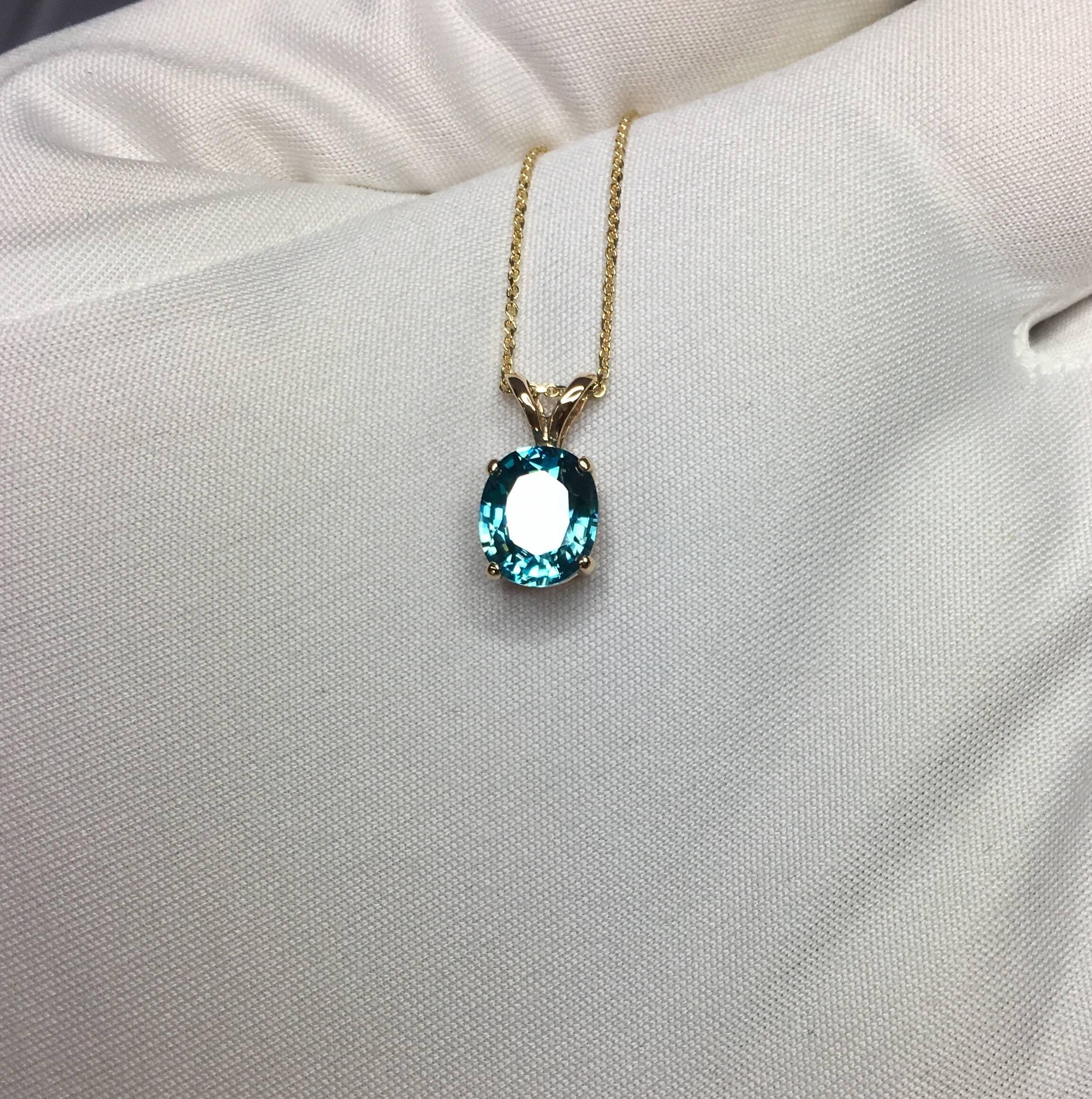 2.50 Carat Vivid Neon Blue Zircon Gold Solitaire Pendant Oval Cut 1