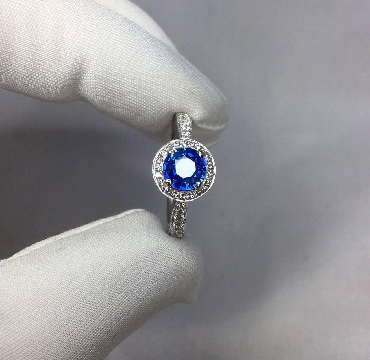 Stunning natural vivid blue Ceylon sapphire set in a fine 18k white gold diamond halo ring.  

1.00 carat centre sapphire with fine cornflower blue colour and excellent clarity.

Ceylon in origin, source of some of the worlds best quality