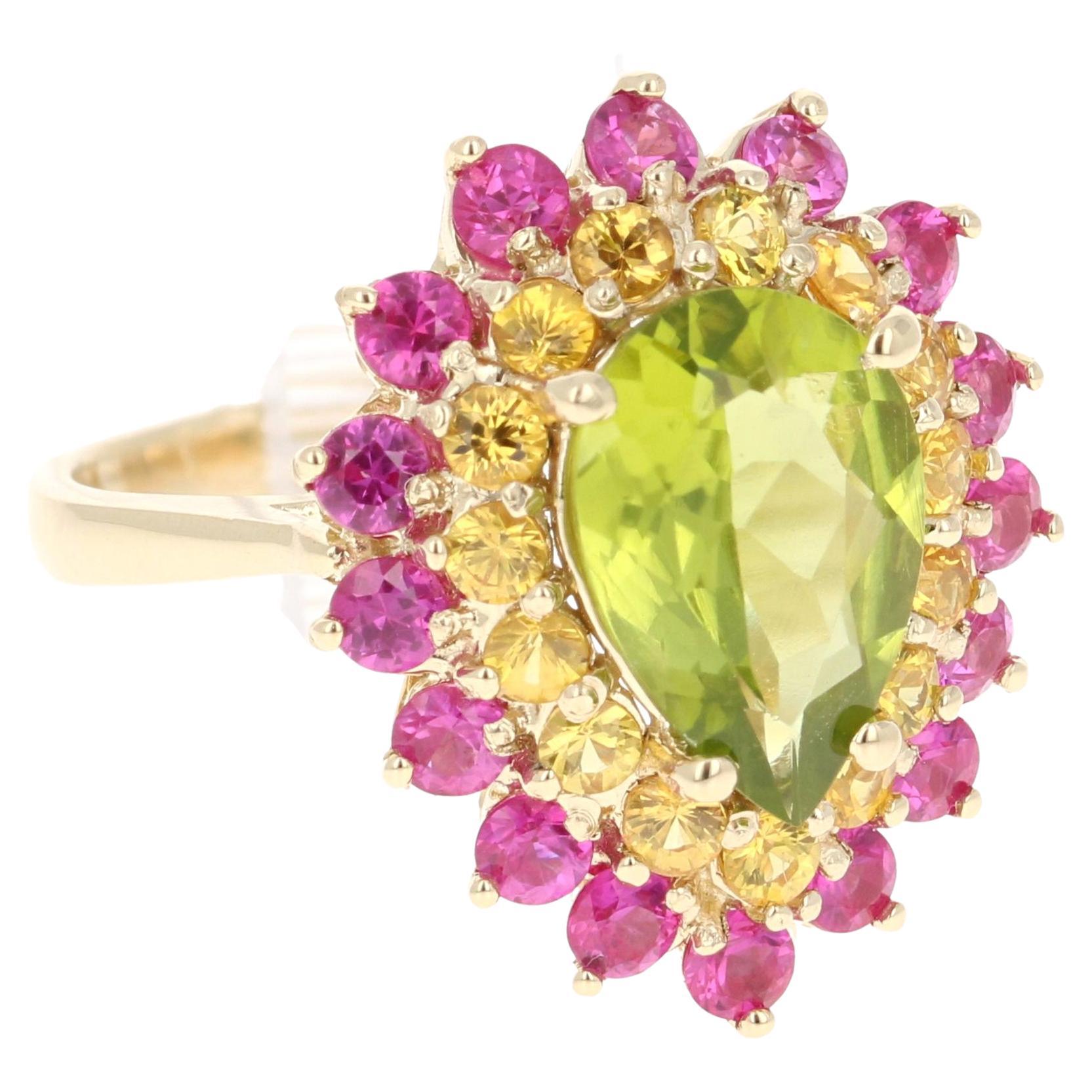 4.68 Carat Natural Peridot Sapphire Yellow Gold Cocktail Ring

This beautiful ring has a Pear Cut Peridot in the center that weighs 2.46 carats. The first halo is of 15 Yellow Sapphires that weigh 0.86 carats and the second halo is of Pink Sapphires