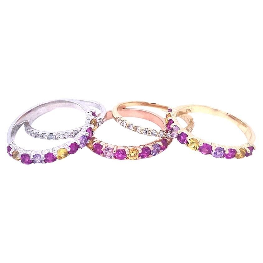 This is a set of 5 Bands and the description is as follows:

3 Multi Color Sapphire Bands = 33 Multi Colored Sapphires weighing 3.36 Carats (Dark Pink, Light Pink and Yellow Sapphires)
2 Round Cut Diamond Bands = 30 Round Cut Diamonds weighing 0.44