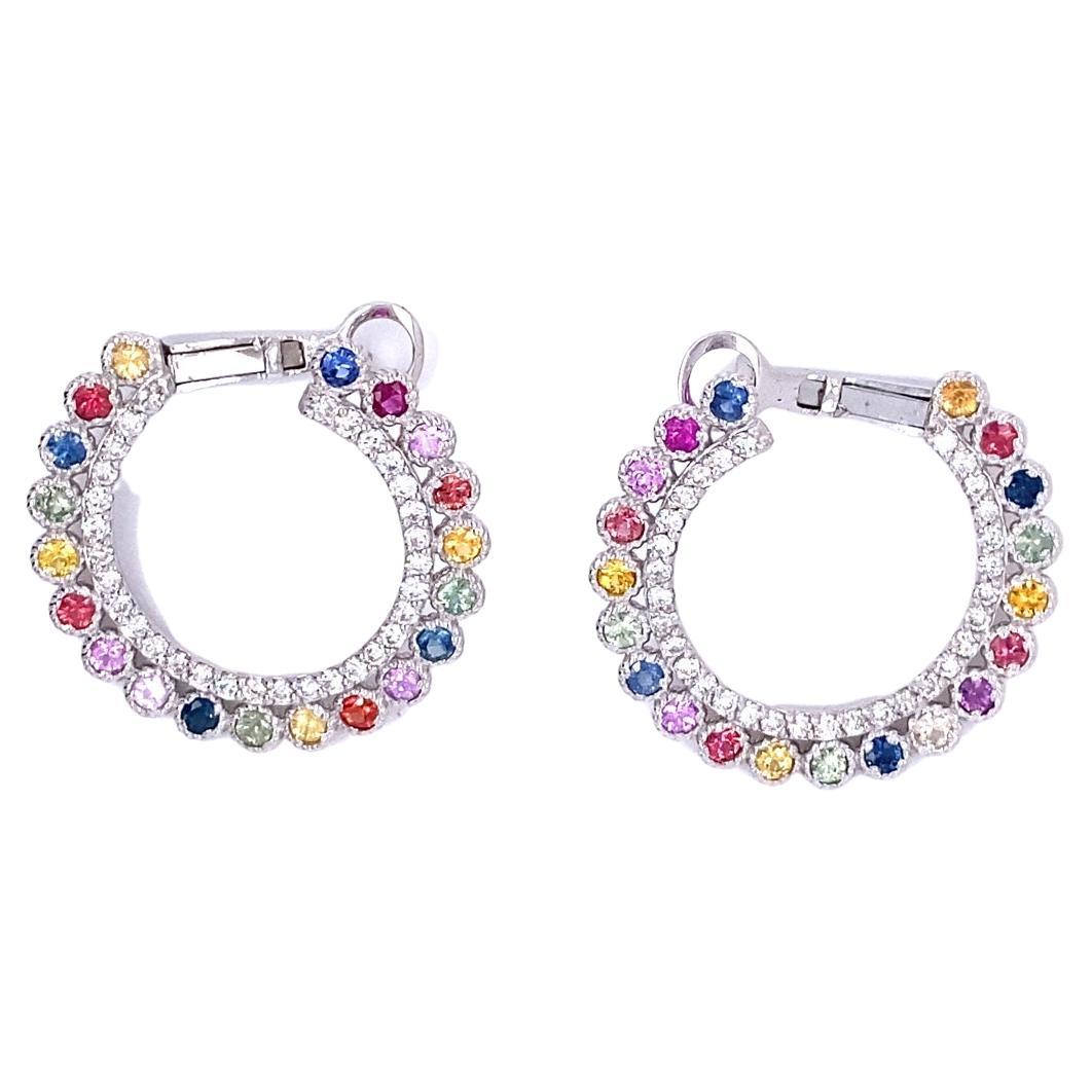 These earrings have Natural Multi Color Sapphires that weigh 2.00 carats and Natural Round Cut Diamonds that weigh 0.94 carats. The total carat weight of the earrings are 2.94 carats.
The clarity and color of the diamonds are SI2-F.
The length and
