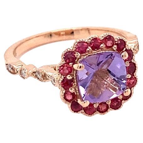 1.86 Carat Cushion Cut Amethyst Diamond Sapphire Rose Gold Ring

This cute and dainty ring is great for everyday wear!!  It has a 1.31 carat Cushion Cut Amethyst and is surrounded by 16 Round Cut Red Sapphires that weigh 0.43 carats and 12 Round Cut