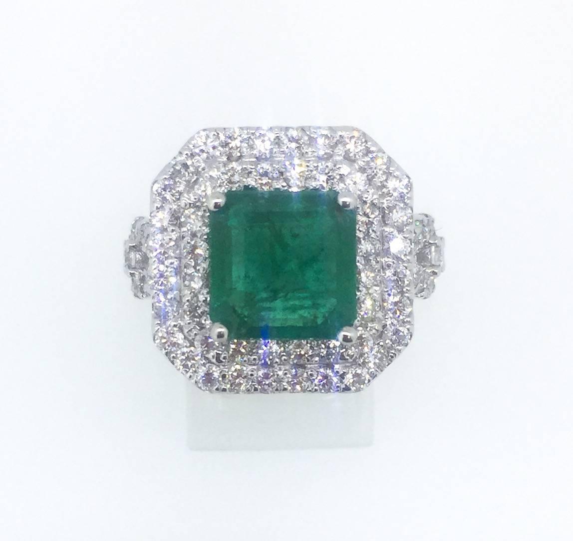 This 18K White Gold Ring has a Square Cut Emerald that weighs a total of 4.48 carats. It has 78 Round Brilliant Cut Diamonds weighing at 1.80 carats. The gold gram is 10.8gr.  This ring is a ring size of 7 and can be re-sized at no additional