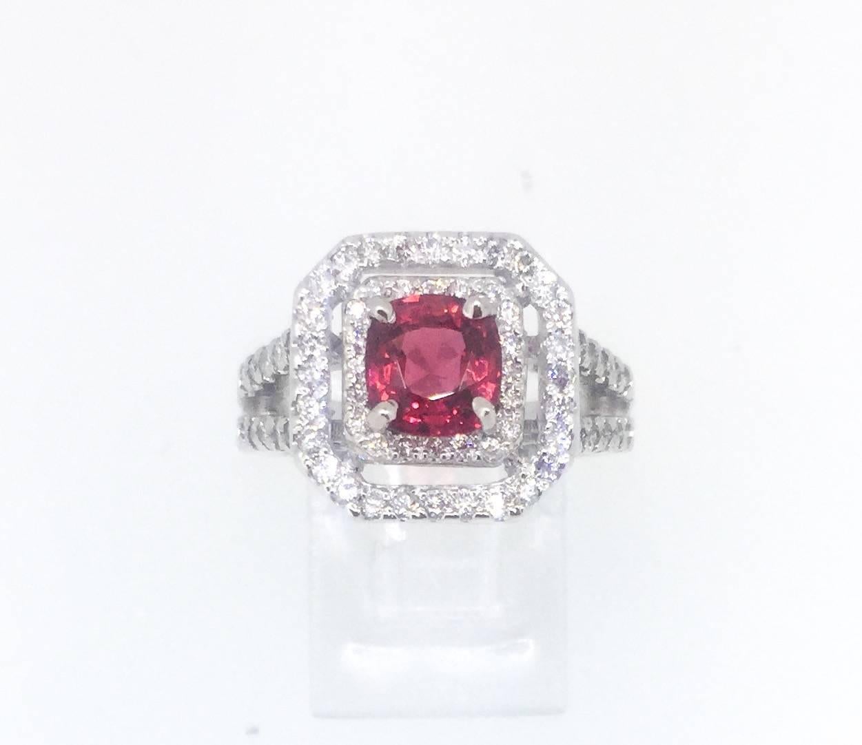 This ring has a 1.34 carat Spinel set in the center surrounded by 90 Round Cut Diamonds that weigh a total of 0.87 carats.  The Clarity of the diamonds are VS-SI and the Color is H.  The ring is currently a size 6 and can be re-sized if needed.