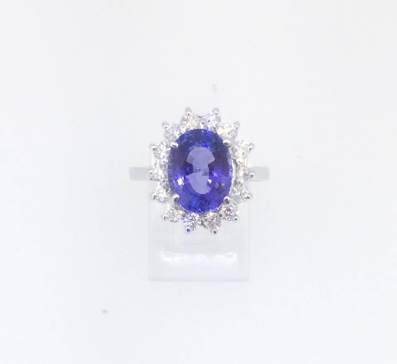 A gorgeous 3.91 Carat Tanzanite and Diamond Ring! 

The Tanzanite is an Oval cut stone and weighs 3.28 carats.  The ring is surrounded by 14 Round Brilliant Cut diamonds that weigh 0.63 carats. (Clarity: SI1 and Color: F)  The total carat weight of