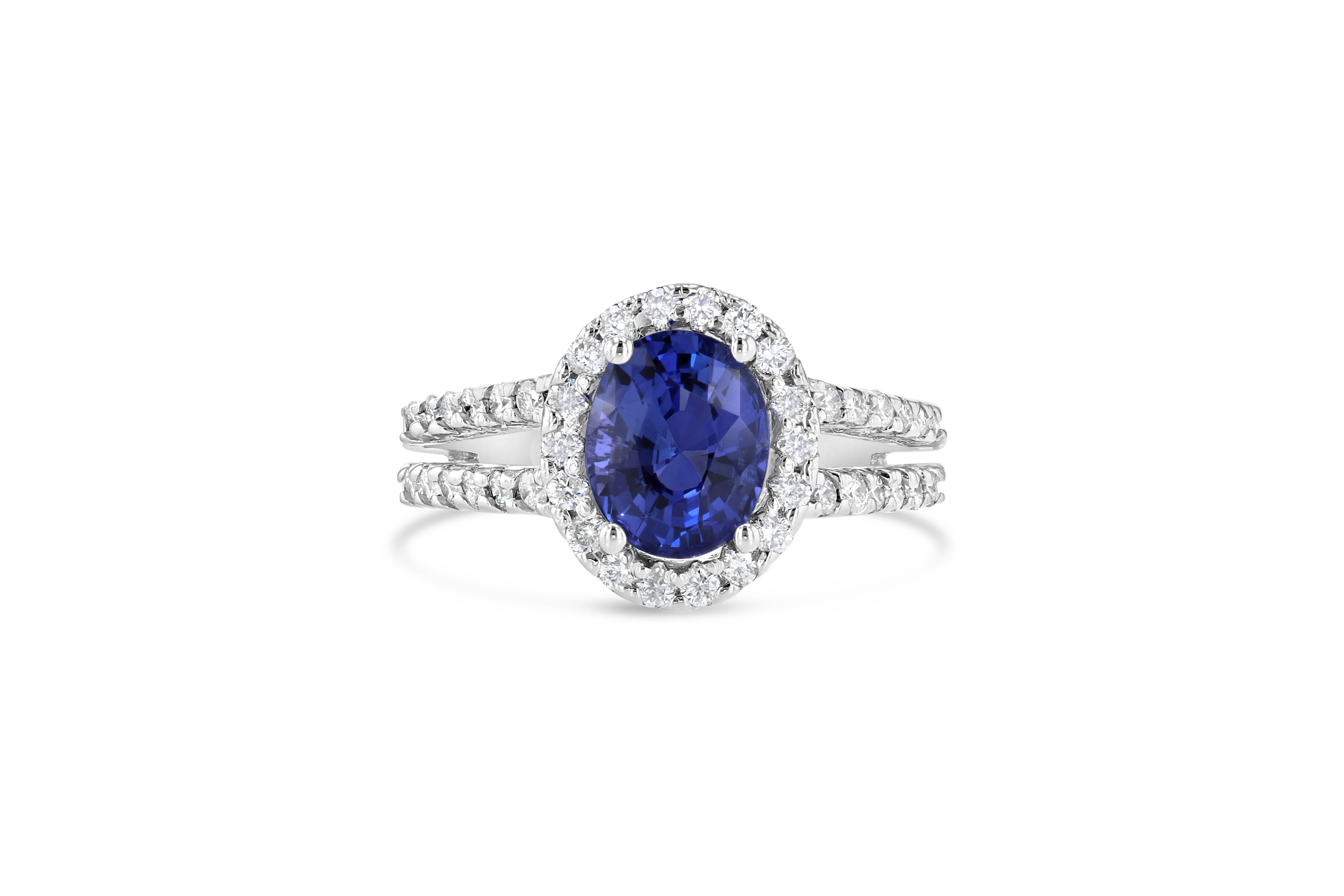 Beautiful Blue Sapphire and Diamond Ring!  This ring has a 2.62 carat Oval Cut Blue Sapphire in the center of the ring and is surrounded by a Halo of 42 Round Cut Diamonds that weigh 0.62 carats.  The clarity and color is SI2/F.  This ring is casted