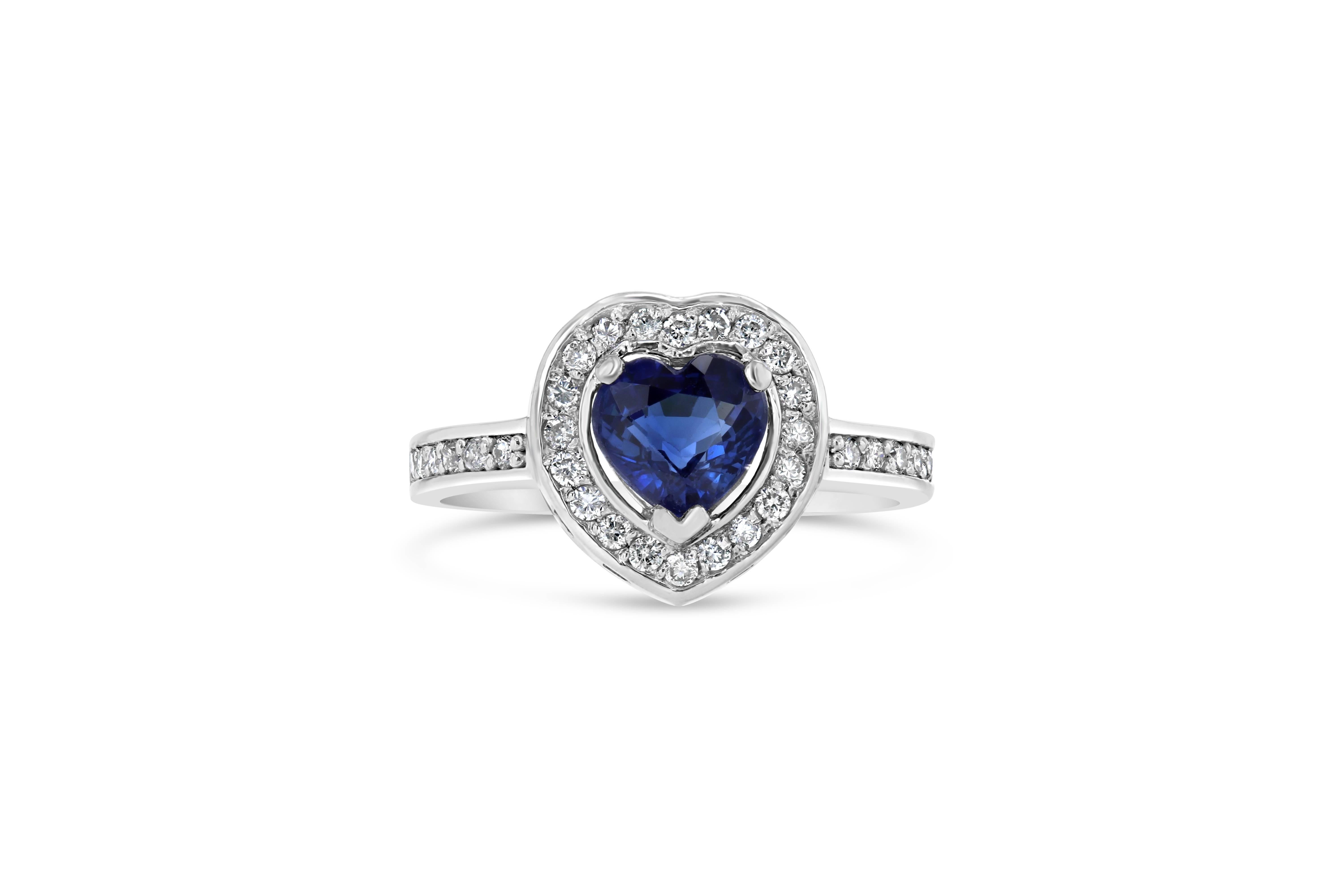 Beautiful Blue Sapphire and Diamond Engagement Ring!  This ring has a 1.18 carat Heart Cut Blue Sapphire in the center of the ring and is surrounded by 32 Round Cut Diamonds that weigh 0.31 carats.  This ring is casted in 14K White Gold and weighs