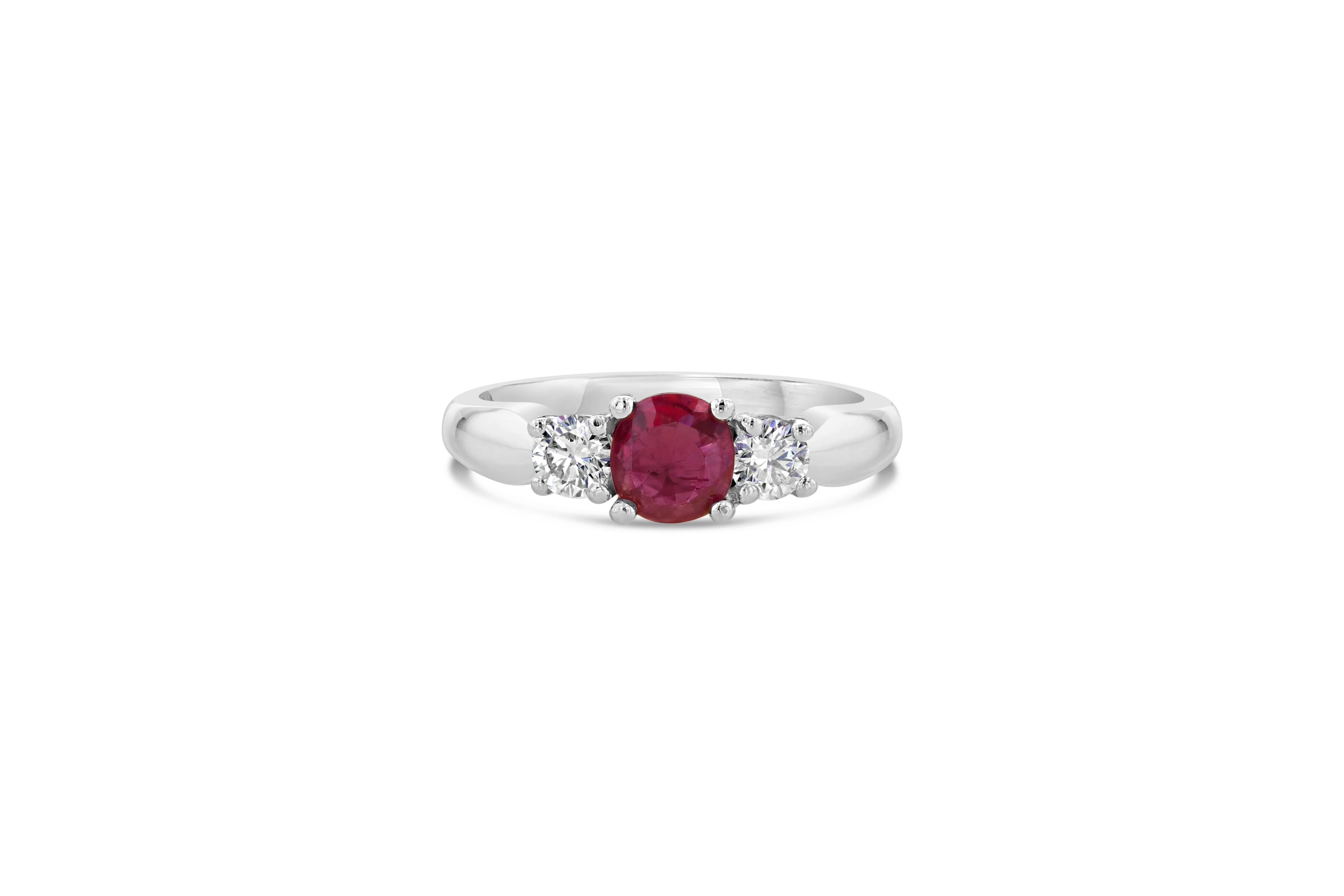 This timeless design represents the past, present and future of a relationship; with a romantic Ruby as its center stone. The Ruby is natural and weighs 0.72 Carats and has 2 Round Cut Diamonds on each side weighing a total of 0.38 Carats with a