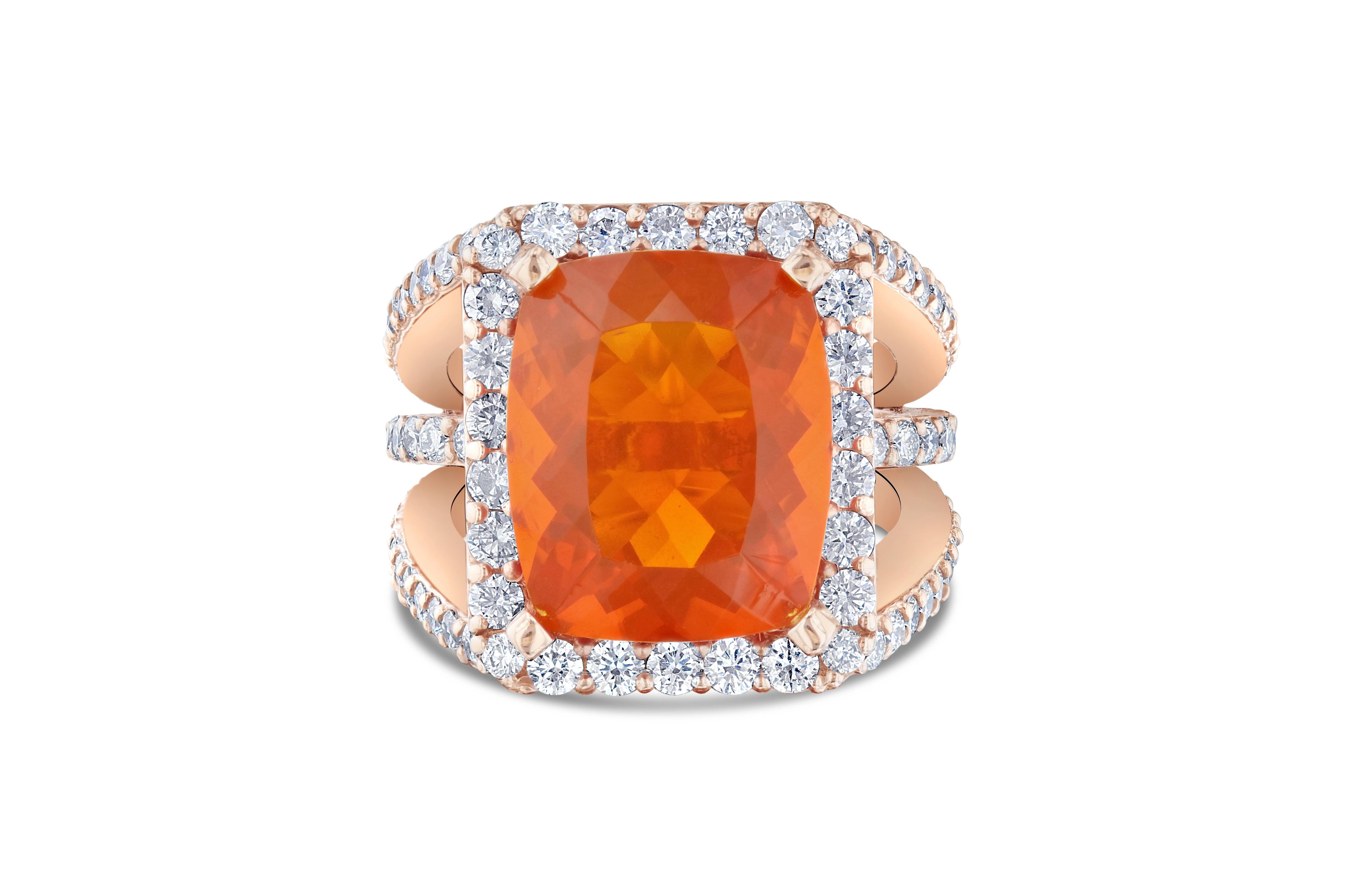 Huge Fire Opal ring for an incredible price!  This ring has a 7.42 carat Fire Opal in the center of the ring and is surrounded by 92 Round Brilliant Cut Diamonds that weigh a total of 2.30 carat.   The total carat weight of the ring is 9.72