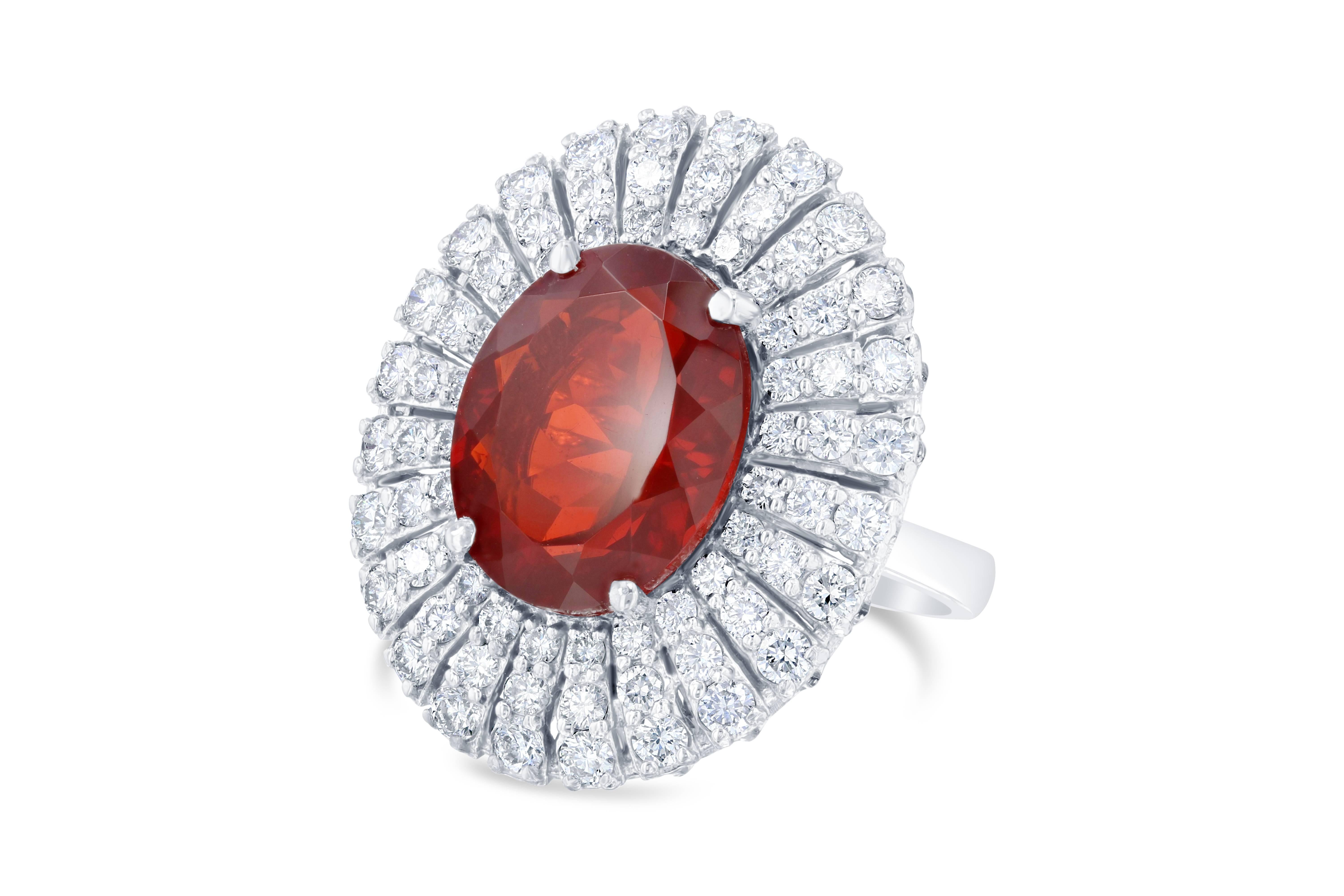 A real SHOW STOPPER!!  This ring has a gorgeous 5.10 carat Fire Opal in the center of the ring and is surrounded by 72 Round Brilliant Cut Diamonds that weigh a total of 1.71 carats.  The Clarity is a VS and the Color is H.  The ring is casted in