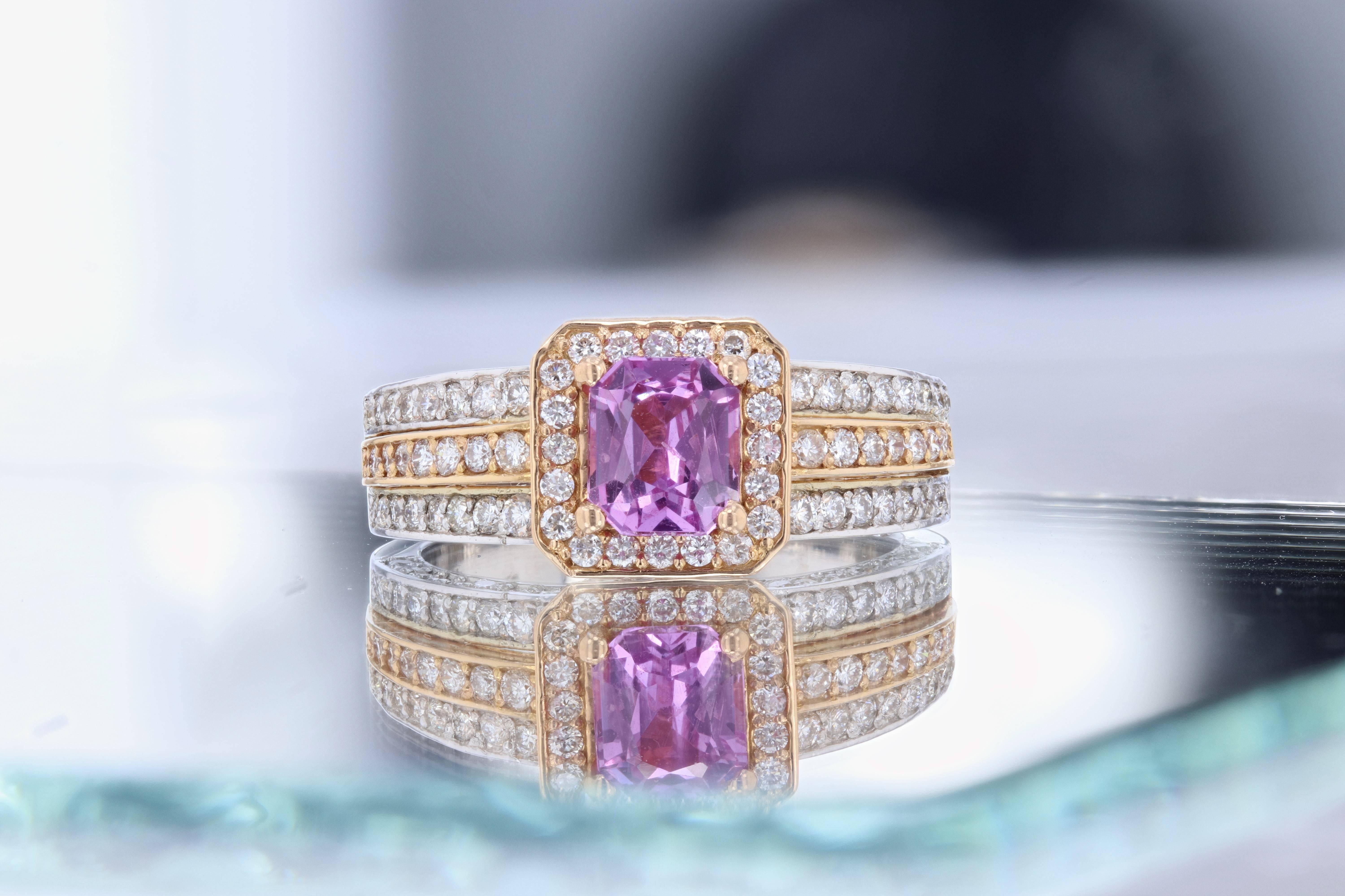 Gorgeous two-tone engagement ring alternative! This ring has a Rectangular Cut 1.07 carat Pink Sapphire in the center of the ring and is surrounded by 126 Round Cut Diamonds that weigh 0.97 carat. This two-tone ring is casted in 18K White and Rose