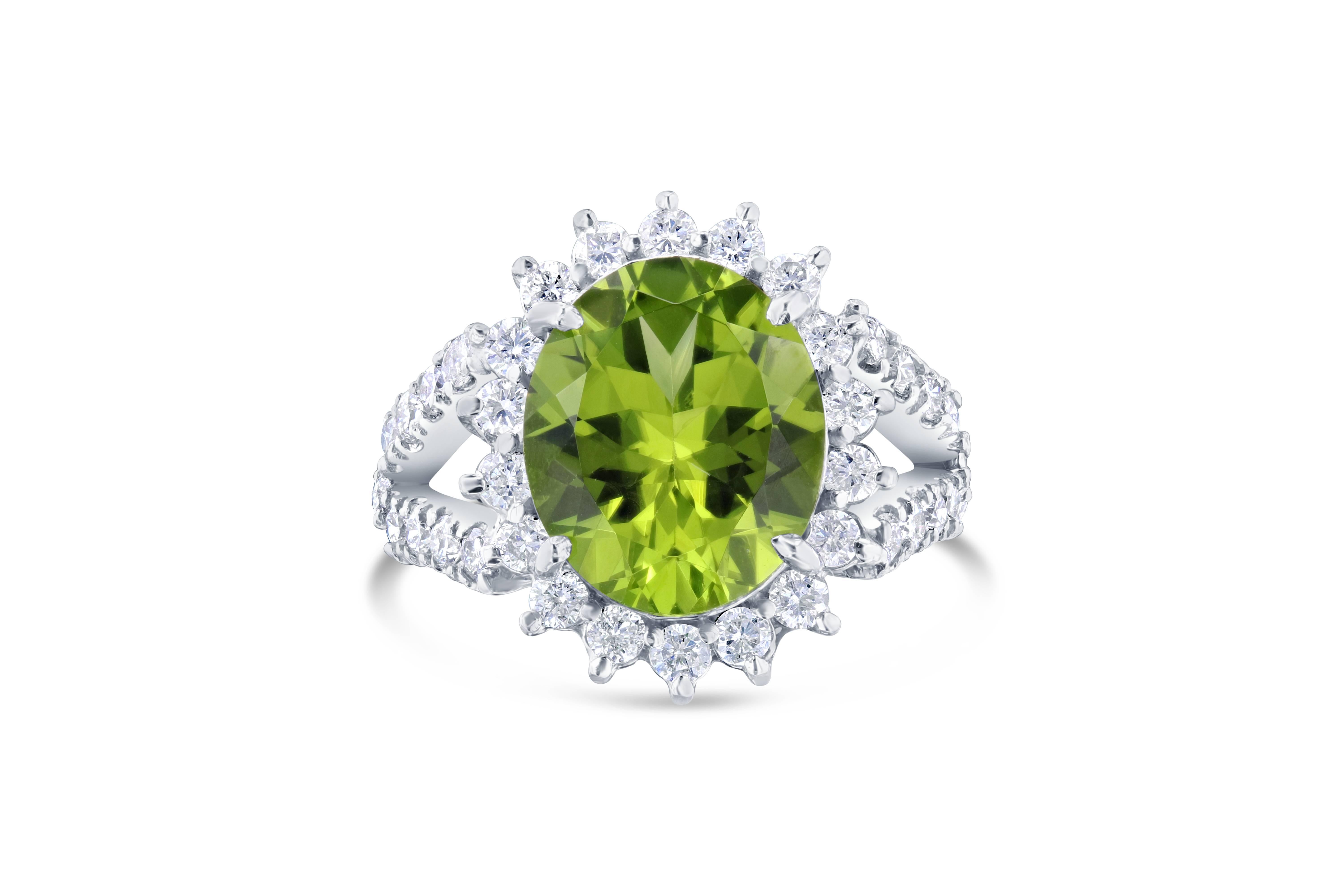 This ring is a classic Ballerina Style and has large Oval Cut Peridot in the center of the ring that weighs 4.48 carats.  The ring is surrounded by 36 Round Cut Diamonds that weigh 0.98 carat.  The ring is casted in 14K White Gold and weighs
