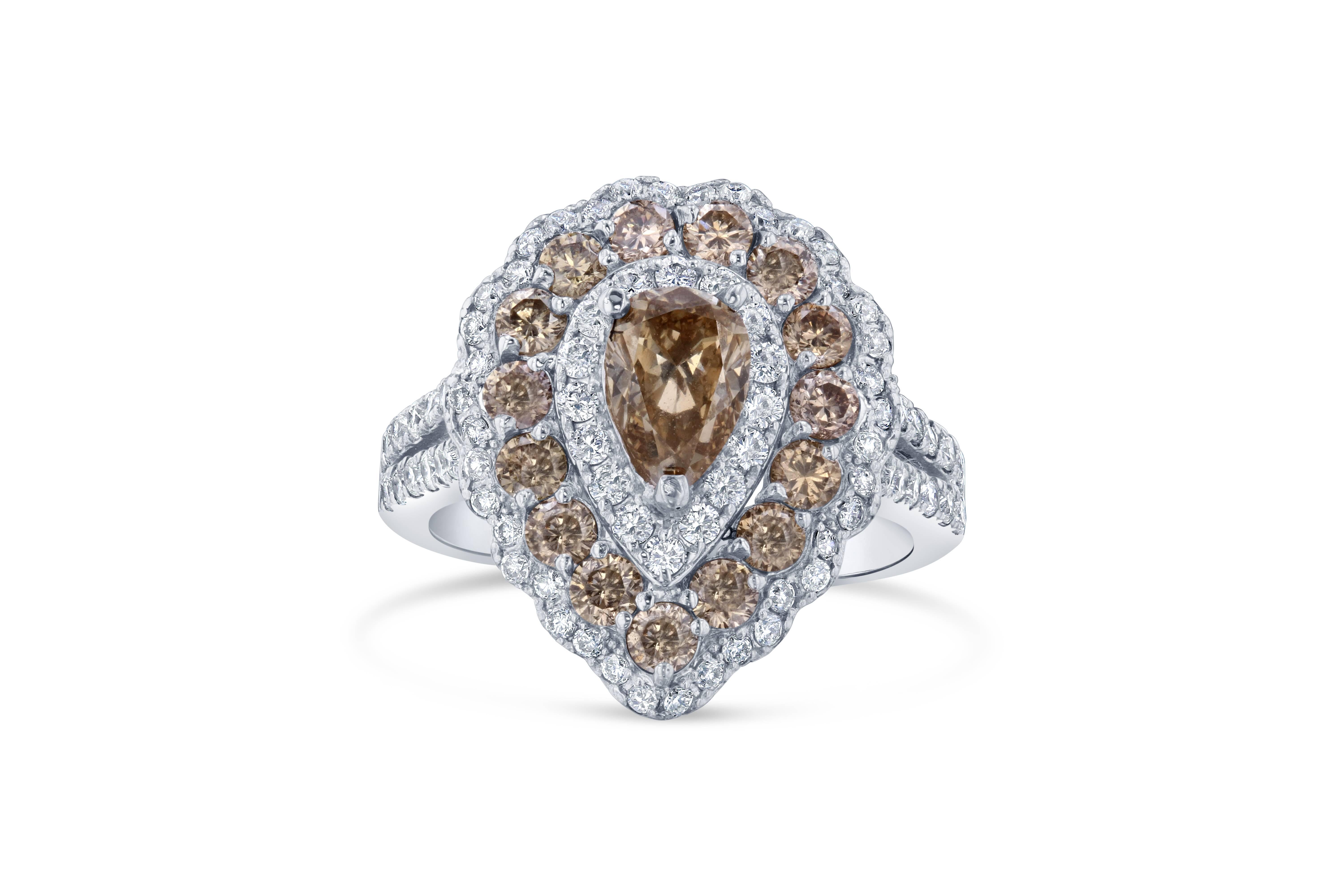 2.68 Carat Natural Fancy Champagne Diamond White Gold Cocktail Ring 

Elegance and beauty at its best - this ring is a stunner!  In the center of this ring, there is a 1.01 carat Pear Cut Natural Champagne diamond which is surrounded by 15 Round Cut