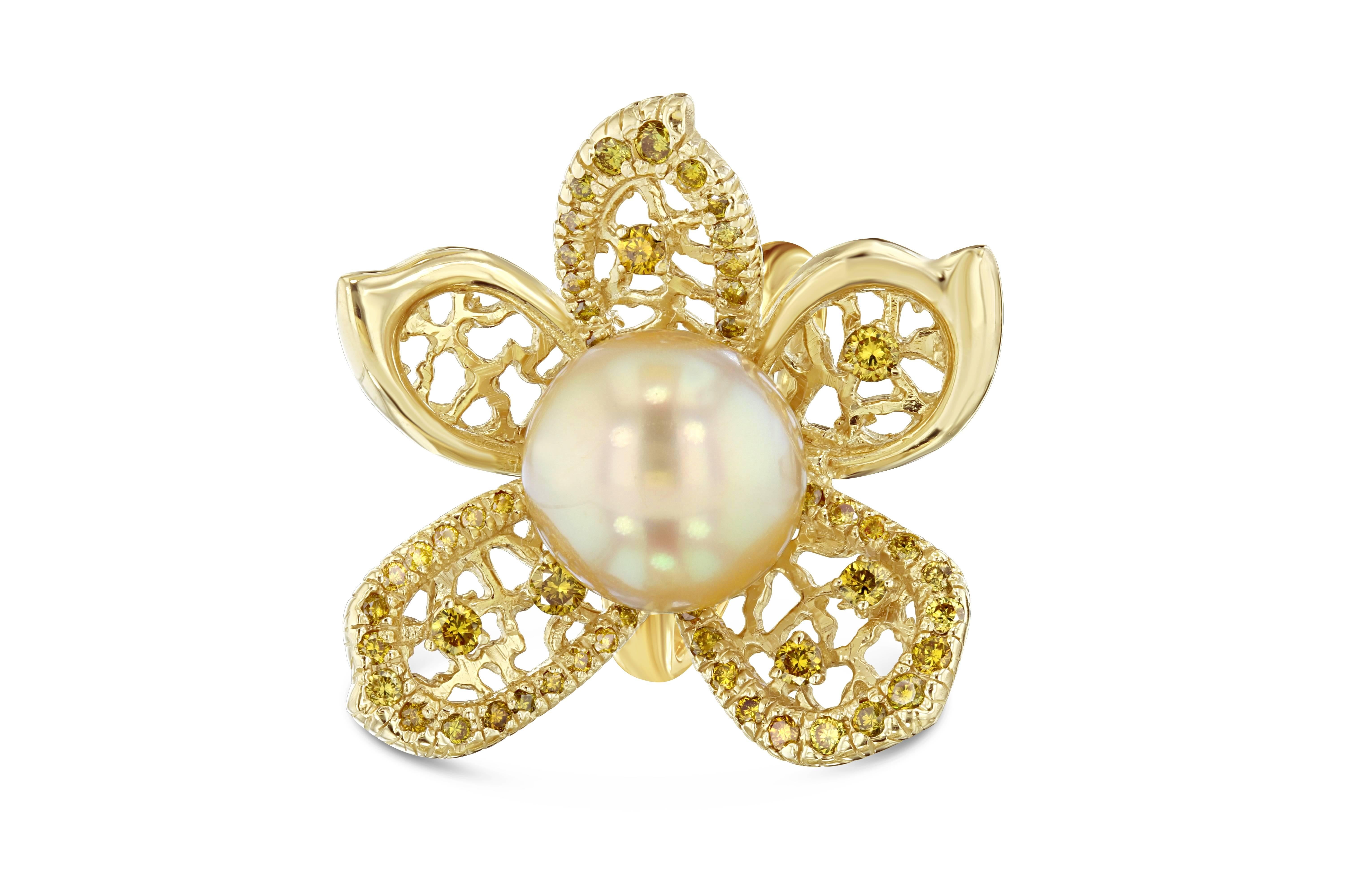 This one of a kind South Sea Pearl Ring will surely stand out in a crowd. It has a 12 mm Golden South Sea Pearl with 58 Round Cut Yellow Diamonds on the petals weighing 0.92 Carats. The yellow diamonds are natural and a fancy yellow color with the