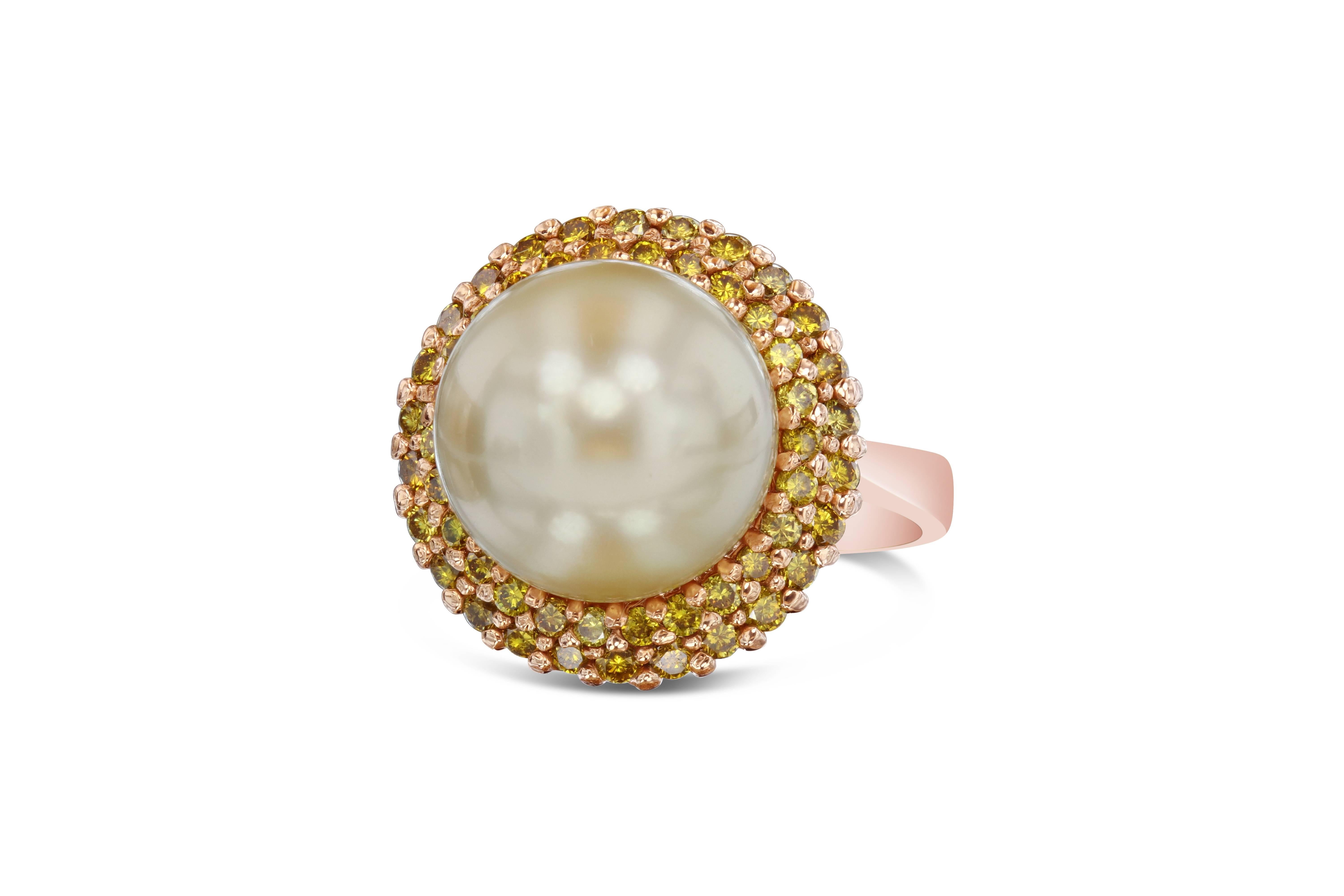 This dome like South Sea Pearl Ring is a remarkable beauty. 

The South Sea Pearl is 12 mm with 52 Natural Fancy Yellow Diamonds weighing 0.82 Carats. The color of the diamonds are Fancy Yellow and the clarity is  VS. 

It is crafted in 14K Rose