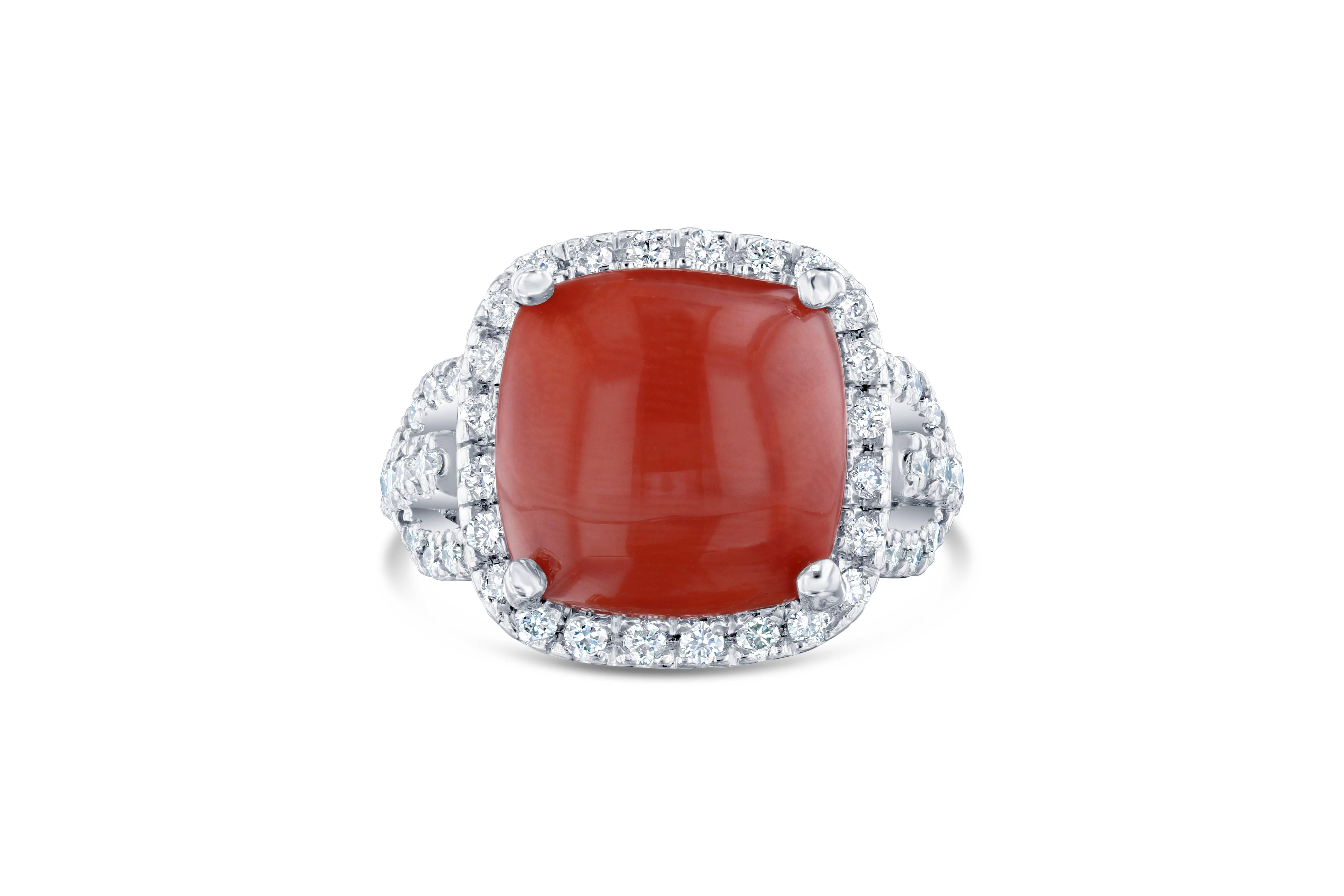 This exquisite Coral Ring is sure to be a stopper at any occasion! The Coral weighs 9.26 Carats and is adorned by 50 Round Cut White Diamonds weighing 1.01 Carats, with a clarity and color of VS-H. The Total Carat Weight of this beauty is 10.27