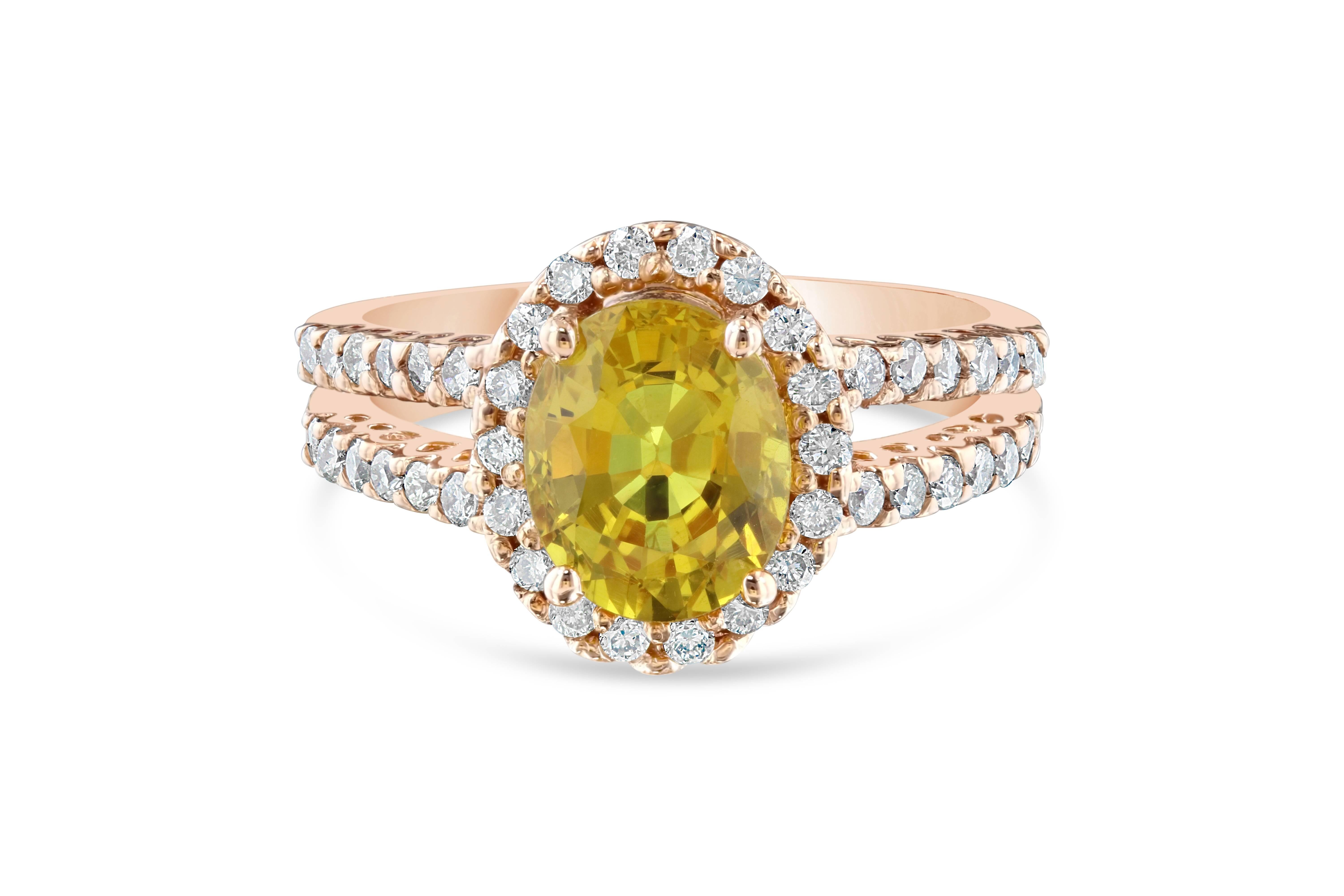 This ring has a 2.70 carat Oval Cut Yellow Sapphire in the center of the ring and is surrounded by a halo 42 Round Cut Diamonds that weigh 0.59 carats (Clarity: VS2, Color: H)  

The ring is casted in 14K Rose Gold and weighs approximately 5.2