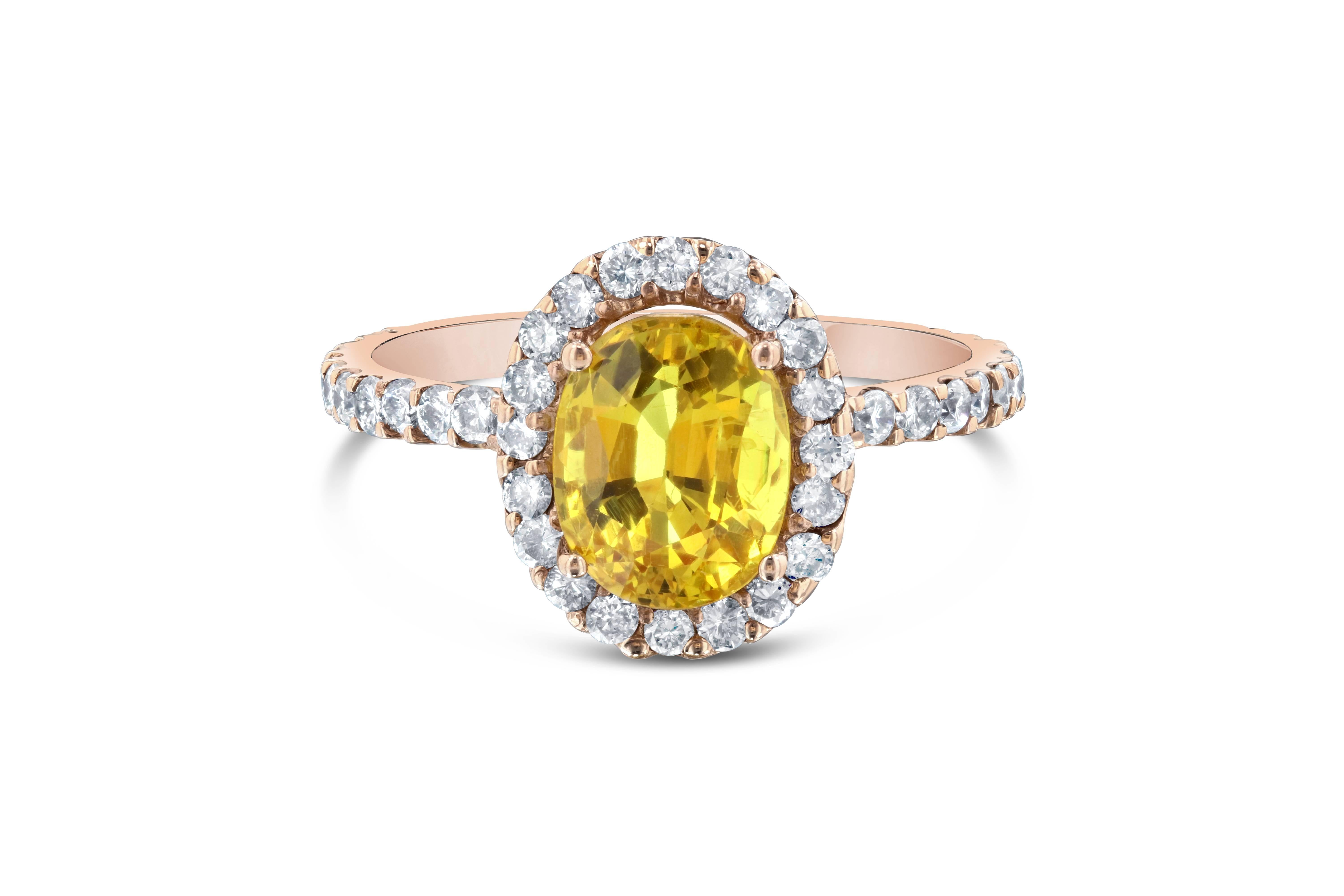 This ring has a 2.63 carat Oval Cut Yellow Sapphire in the center of the ring and is surrounded by a halo 44 Round Cut Diamonds that weigh 0.72 carats. The ring is casted in 14K Rose Gold and weighs approximately 3.1 grams.  This ring is a size 7