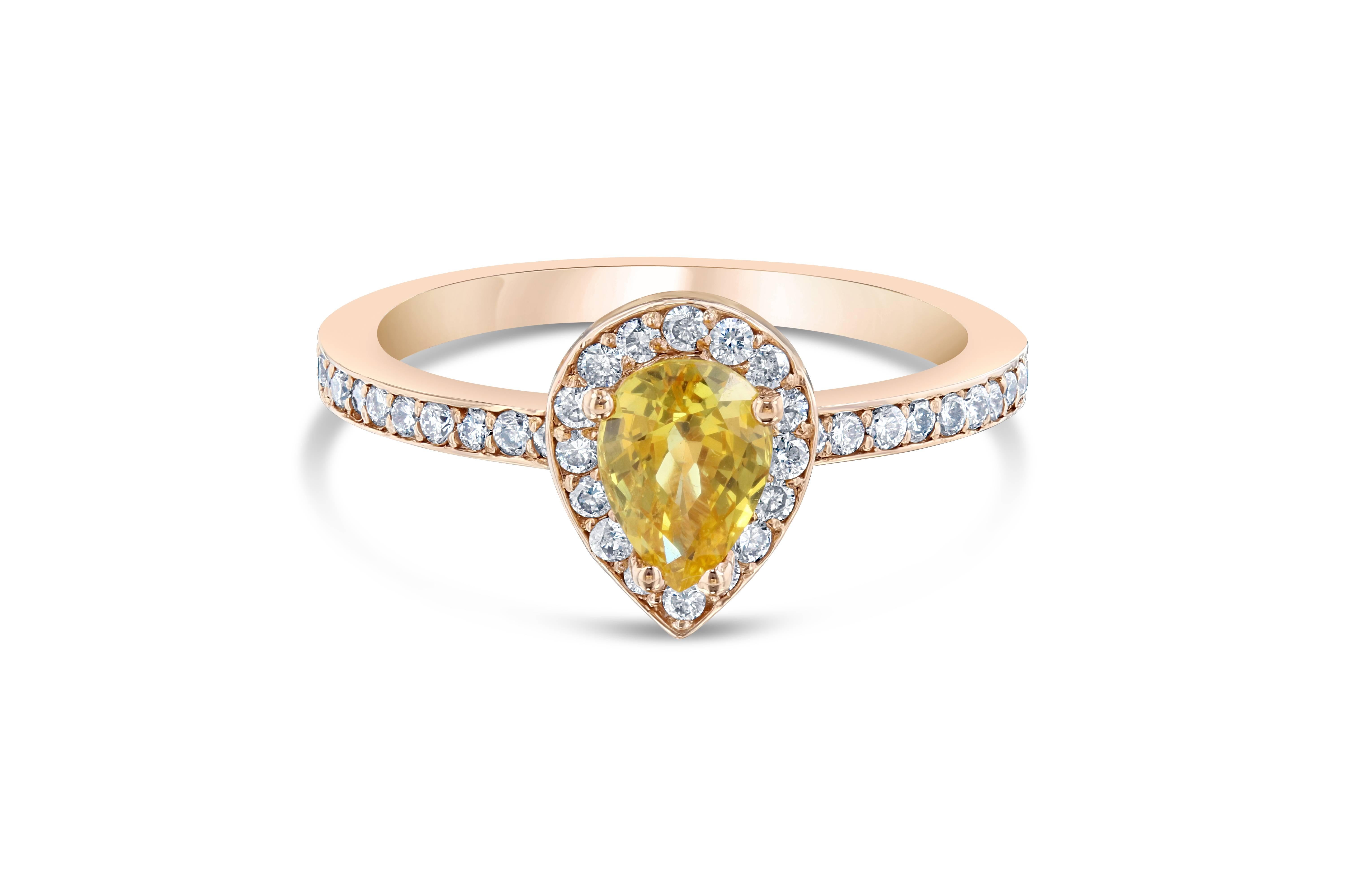 Cute and dainty ring to compliment your everyday jewelry. This ring has a 0.87 carat Pear Cut Yellow Sapphire in the center of the ring and is surrounded by 36 Round Cut Diamonds that weigh 0.37 carat. The ring is casted in 14K Rose Gold and weighs