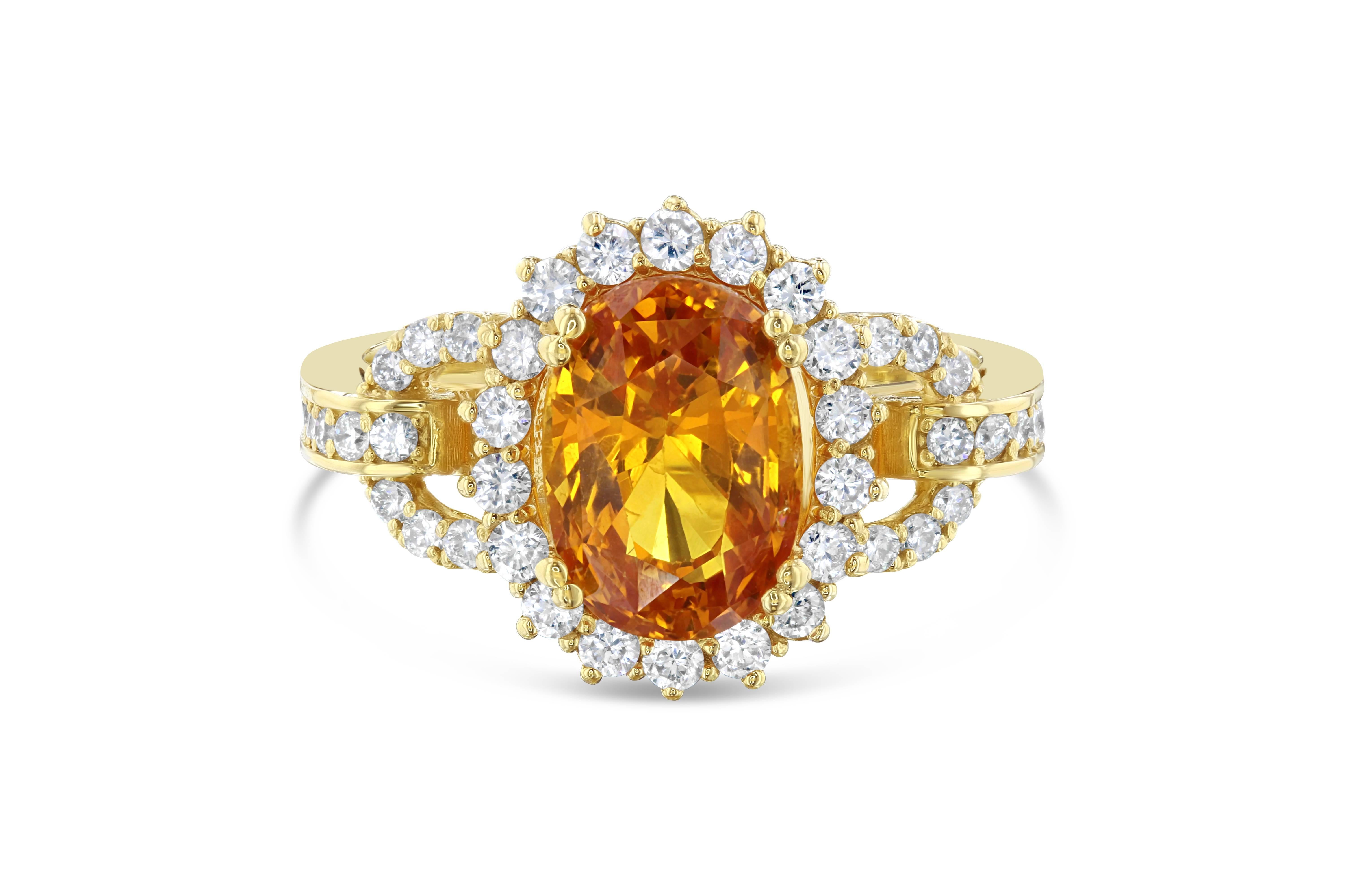 Gorgeous Orange Sapphire and Diamond Cocktail Ring that is GIA Certified.  The Certificate number is:1176095015.  There is a 4.47 carat Oval Cut Orange Sapphire in the center of the ring and it is surrounded by 46 Round Cut Diamonds that weigh 0.66