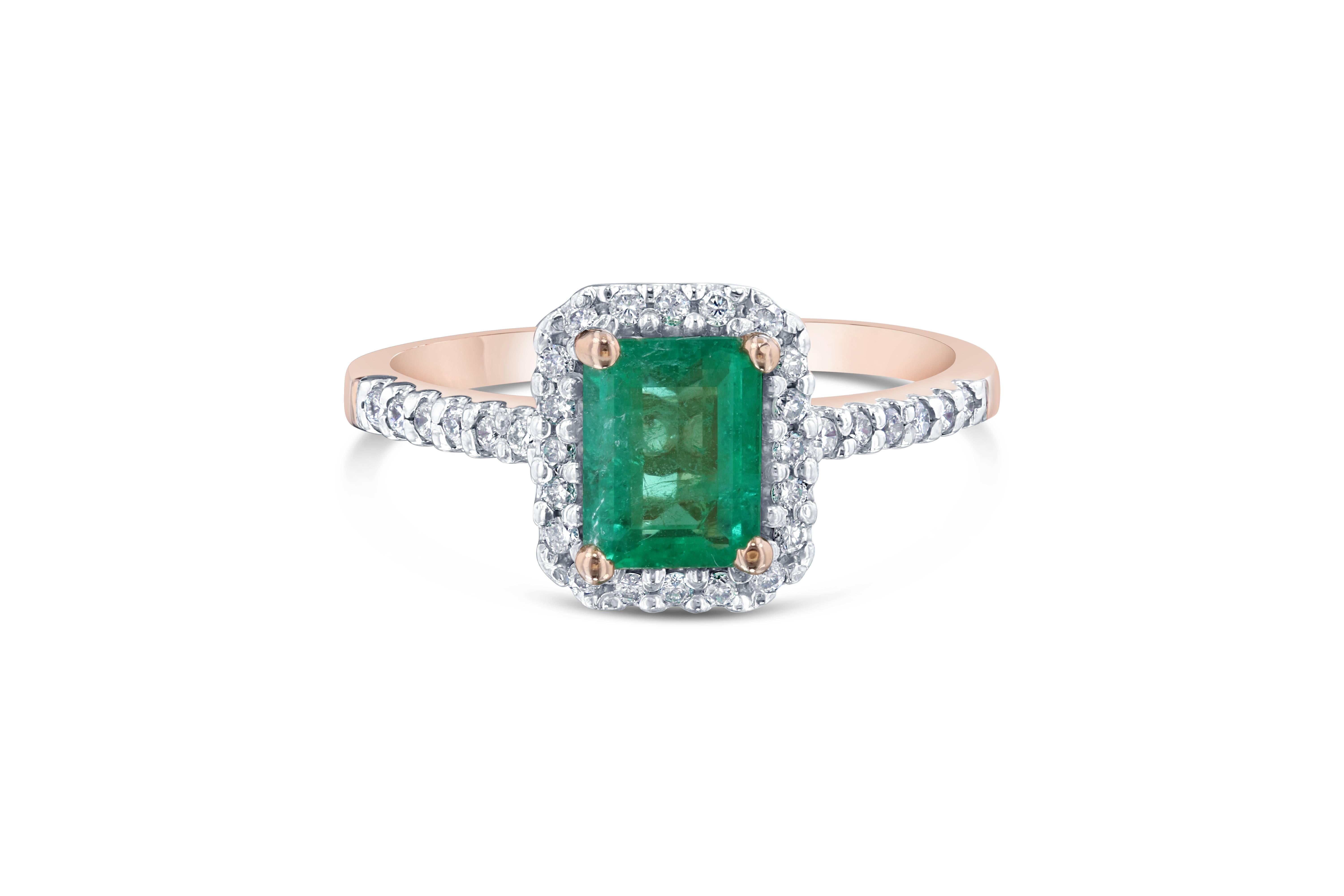 This classic halo setting is ideal for a modern Engagement Ring. The center Emerald is 0.75 Carats and measures at 5 mm x 7 mm. It is surrounded by 32 Round Cut Diamonds that weigh 0.30 Carats. The total carat weight of the ring is 1.05 Carats. 

It