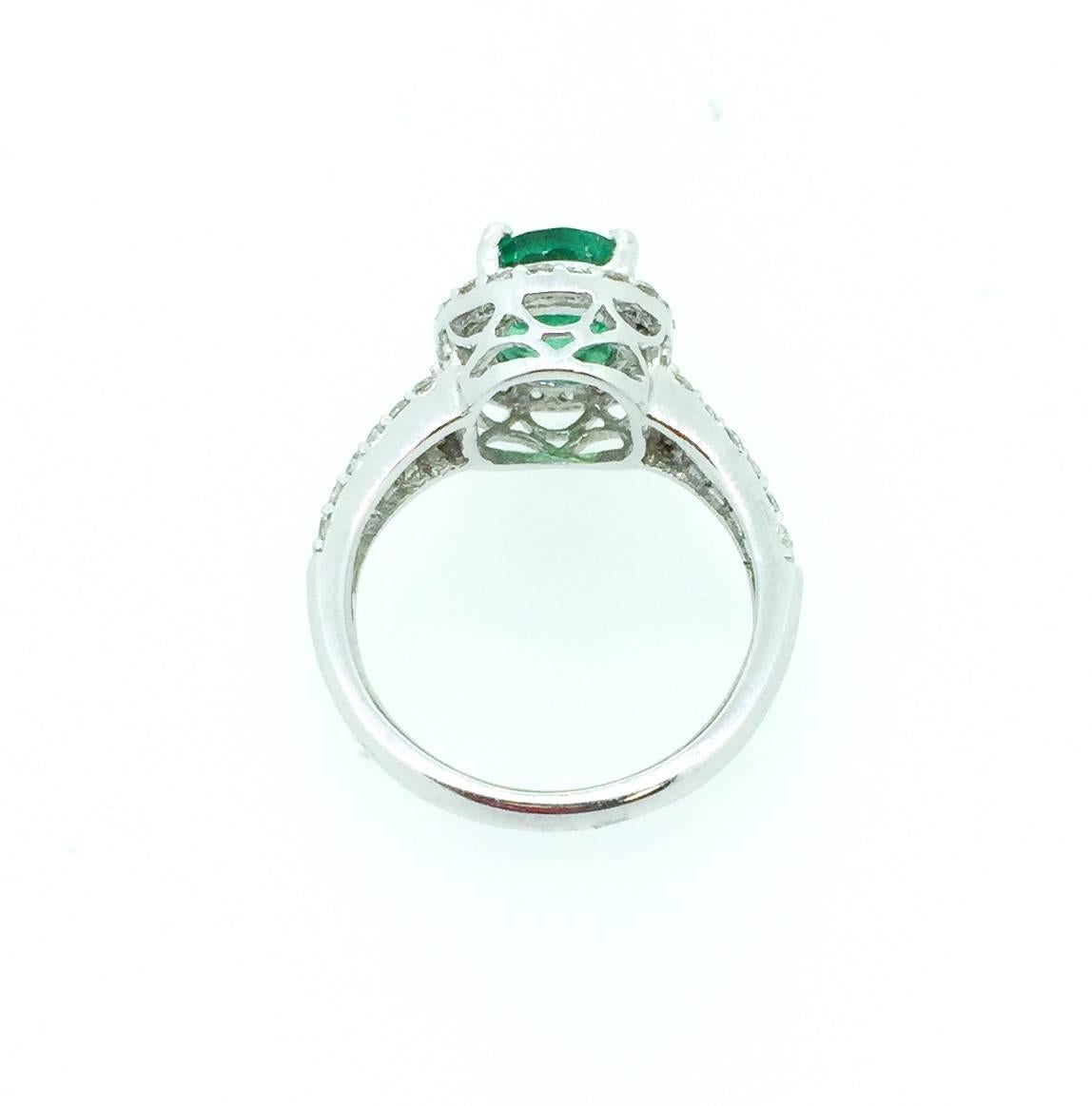 Modern 2.55 Carat Emerald Diamond Halo Ring