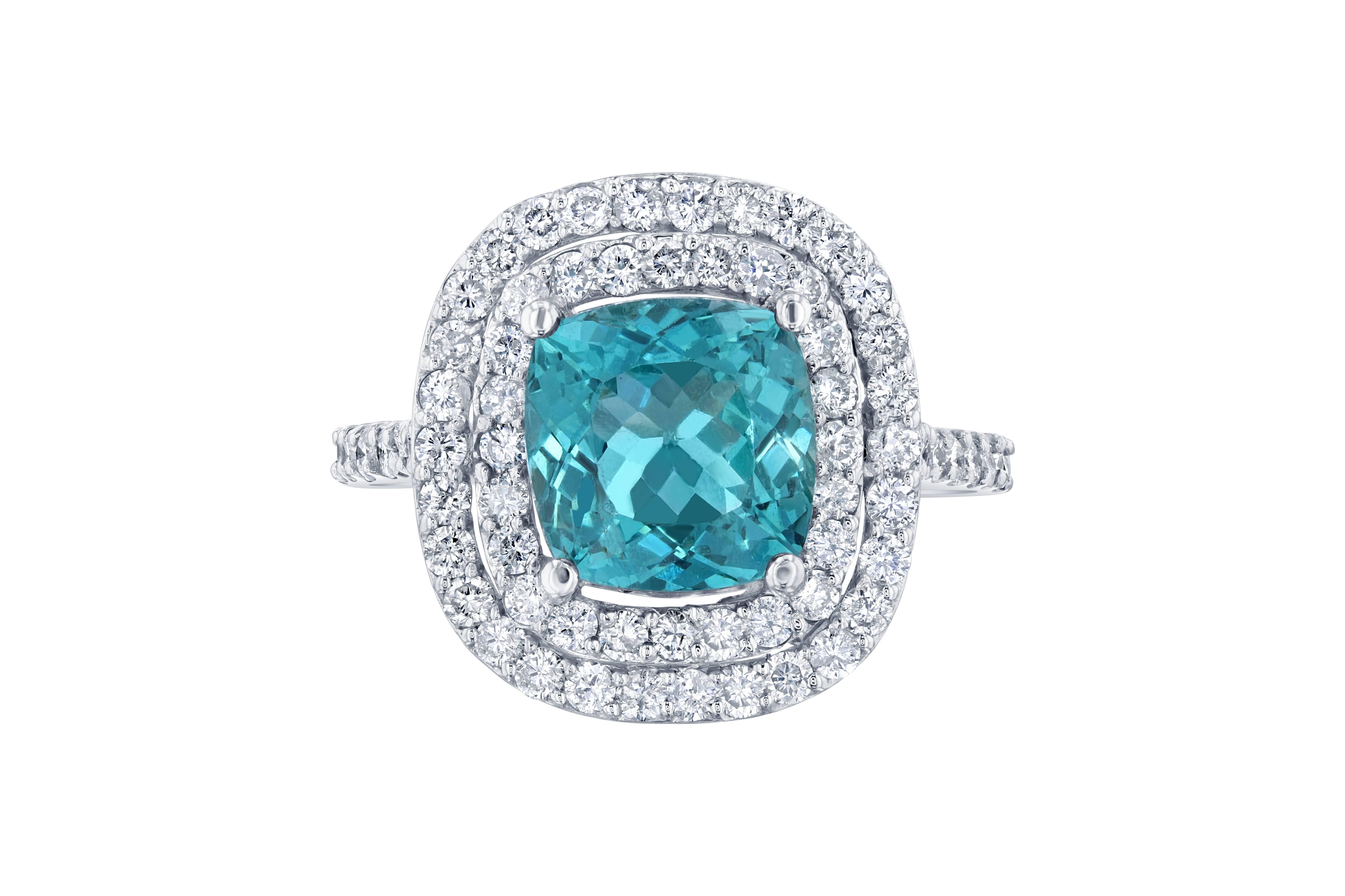 Gorgeous Double Halo Apatite and Diamond Ring.  This ring has a 3.36 carat Apatite in the center of the ring and is surrounded by a double halo of 76 Round Cut Diamonds that weigh 0.97 carat.  The total carat weight of the ring is 4.33 carats.  The