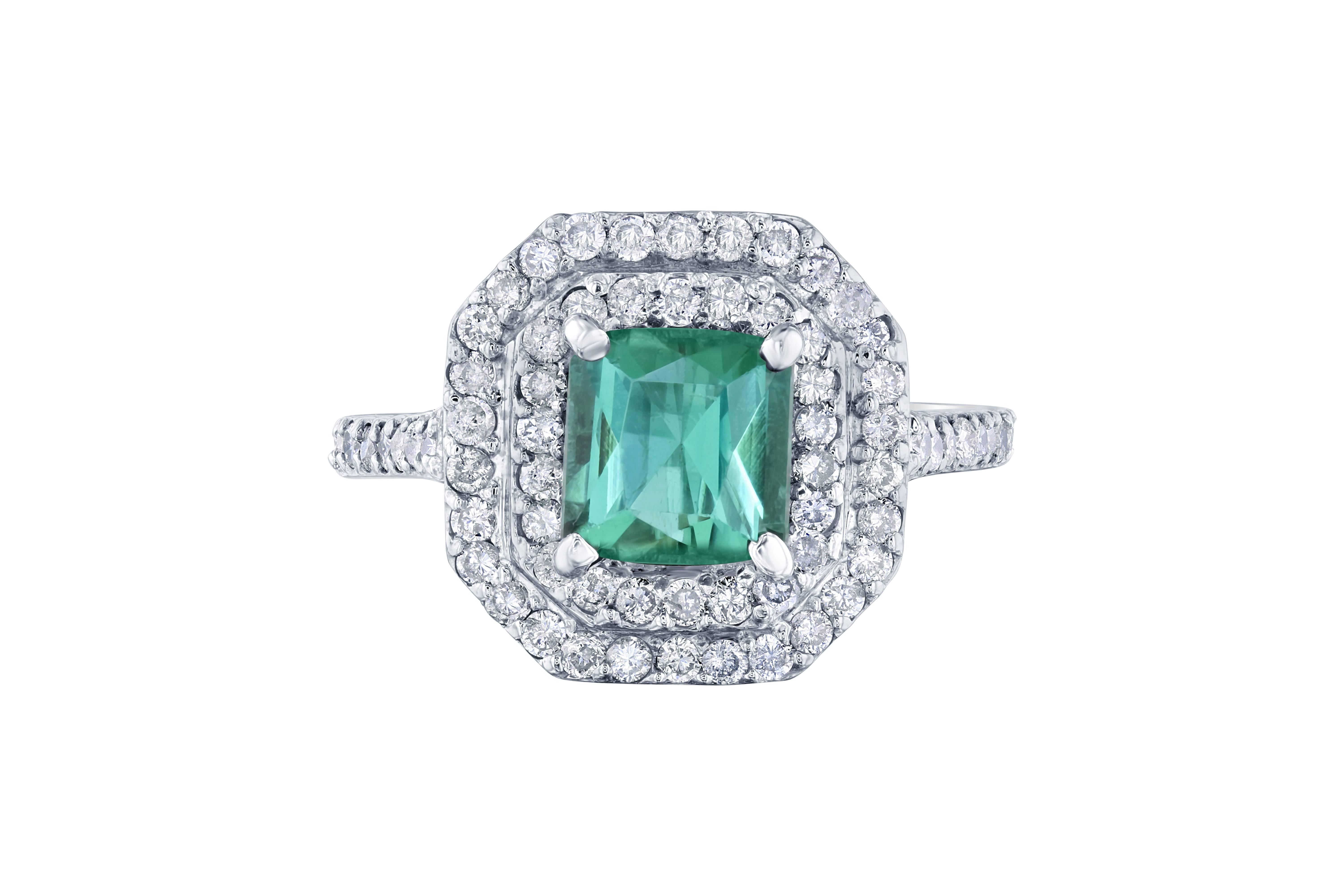 Stunning Green Tourmaline and Diamonds set in a double halo setting! This ring has a 1.75 carat Square Cut Green Tourmaline in the center of the ring and is surrounded by 94 Round Cut Diamonds that weigh 1.00 carats. The total weight of this ring is