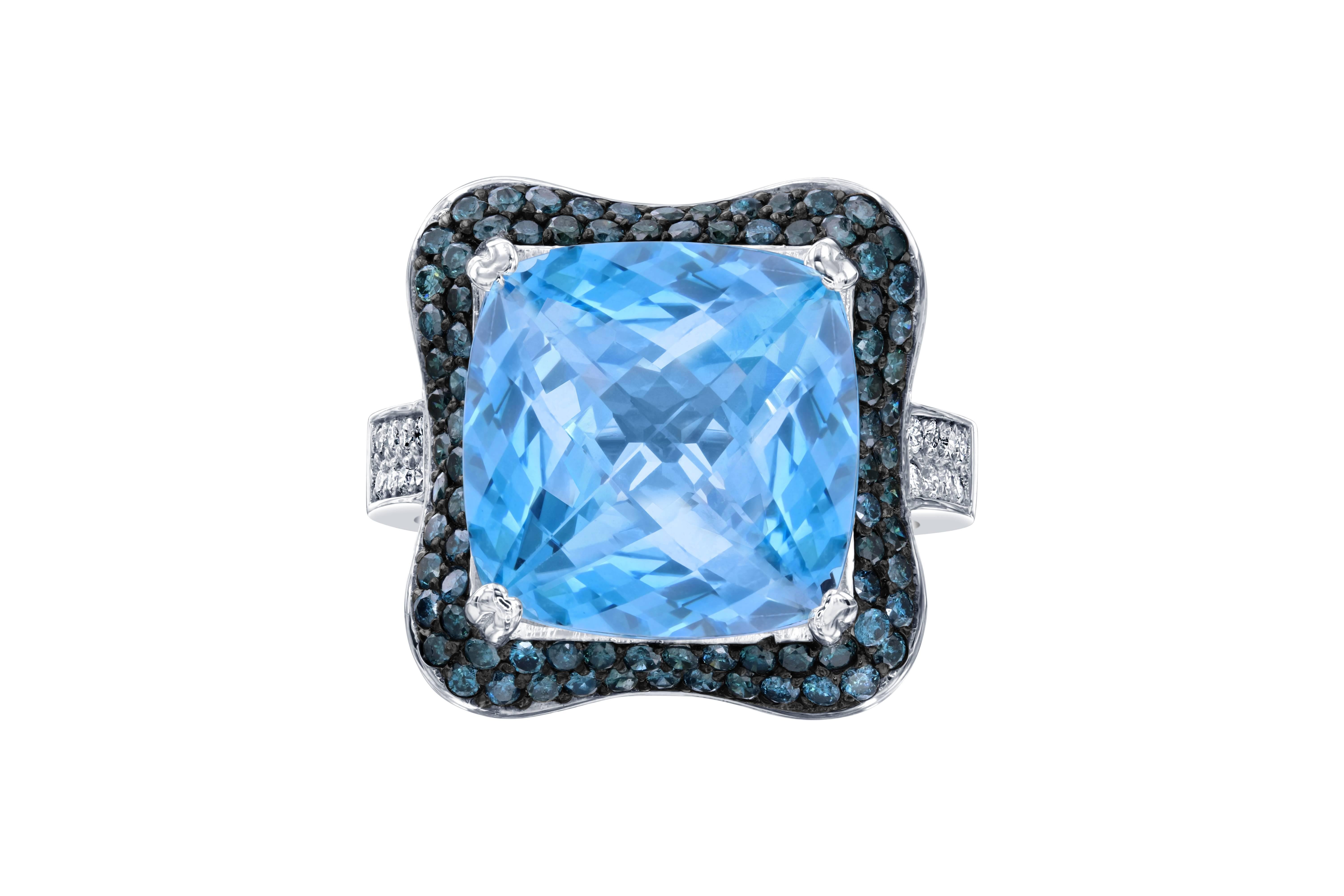 A true statement piece!  This stunning ring has a huge square cut Blue Topaz that weighs 12.35 carats and is surrounded by 84 Blue Round Cut Diamonds that weigh 1.01 carats.  The Blue Diamonds and natural and genuine diamonds that are color treated