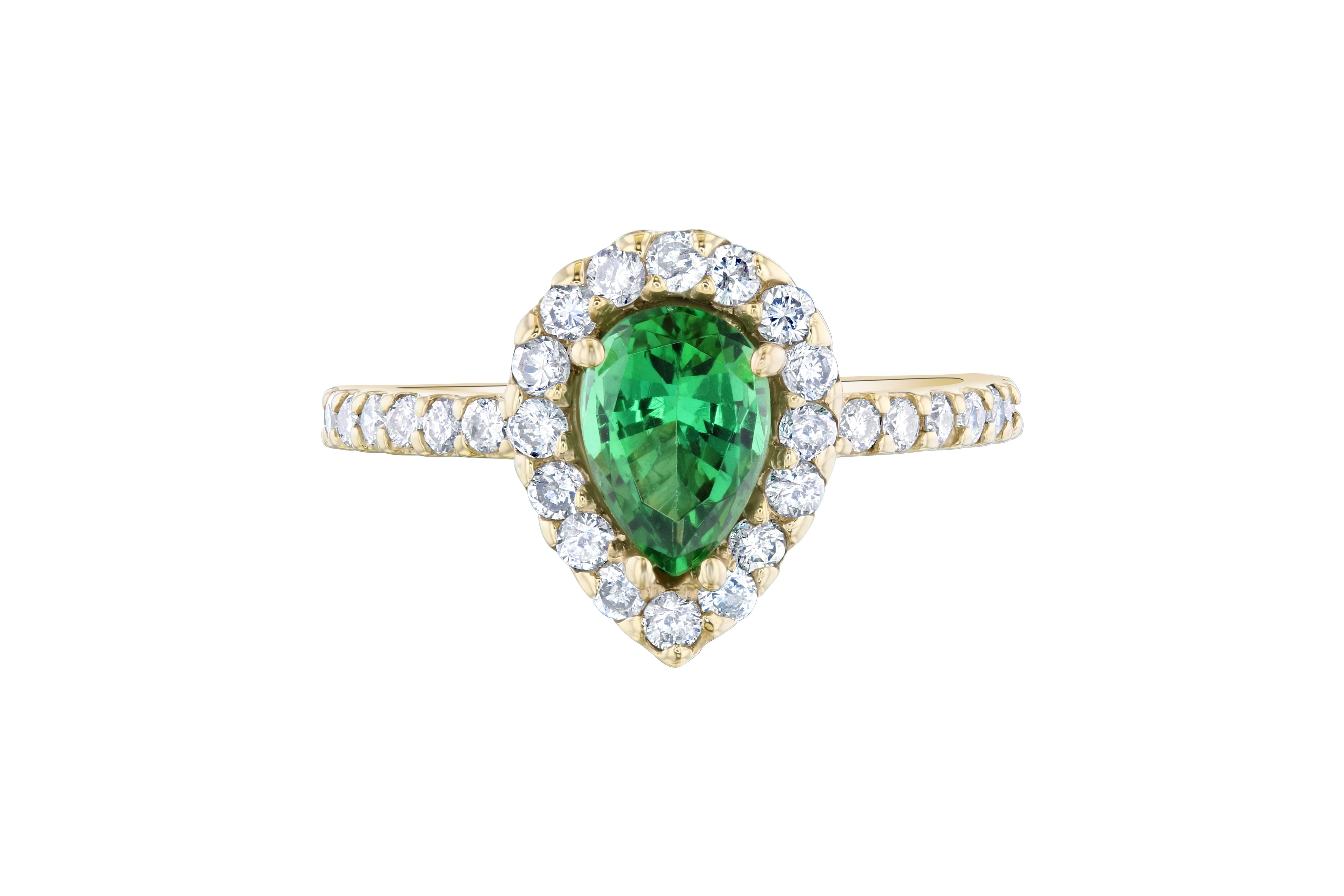 Beautiful ring for a great price!  This ring can easily transform into an engagement ring for the woman who wants to dip into something new and fresh.   

This ring has a Pear cut Tsavorite which weighs 1.04 carats and is surrounded by a halo of 36