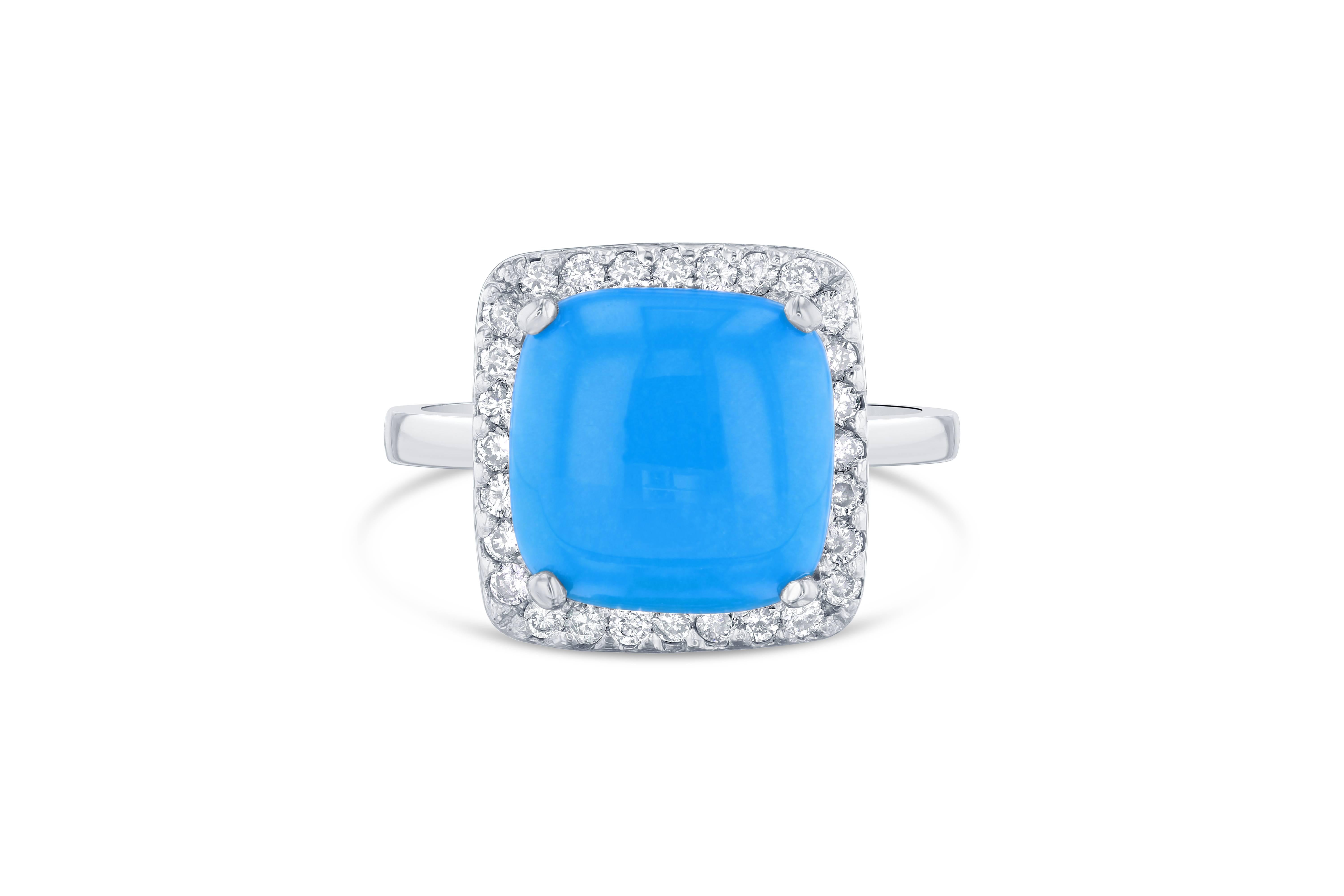 This unique Turquoise and Diamond Ring is delicate yet will make a statement on your finger. 
The Turquoise is Square Cut and weighs 3.03 Carats surrounded by 28 Round Cut Diamonds weighing 0.37 Carats. The total carat weight of the ring is 3.40