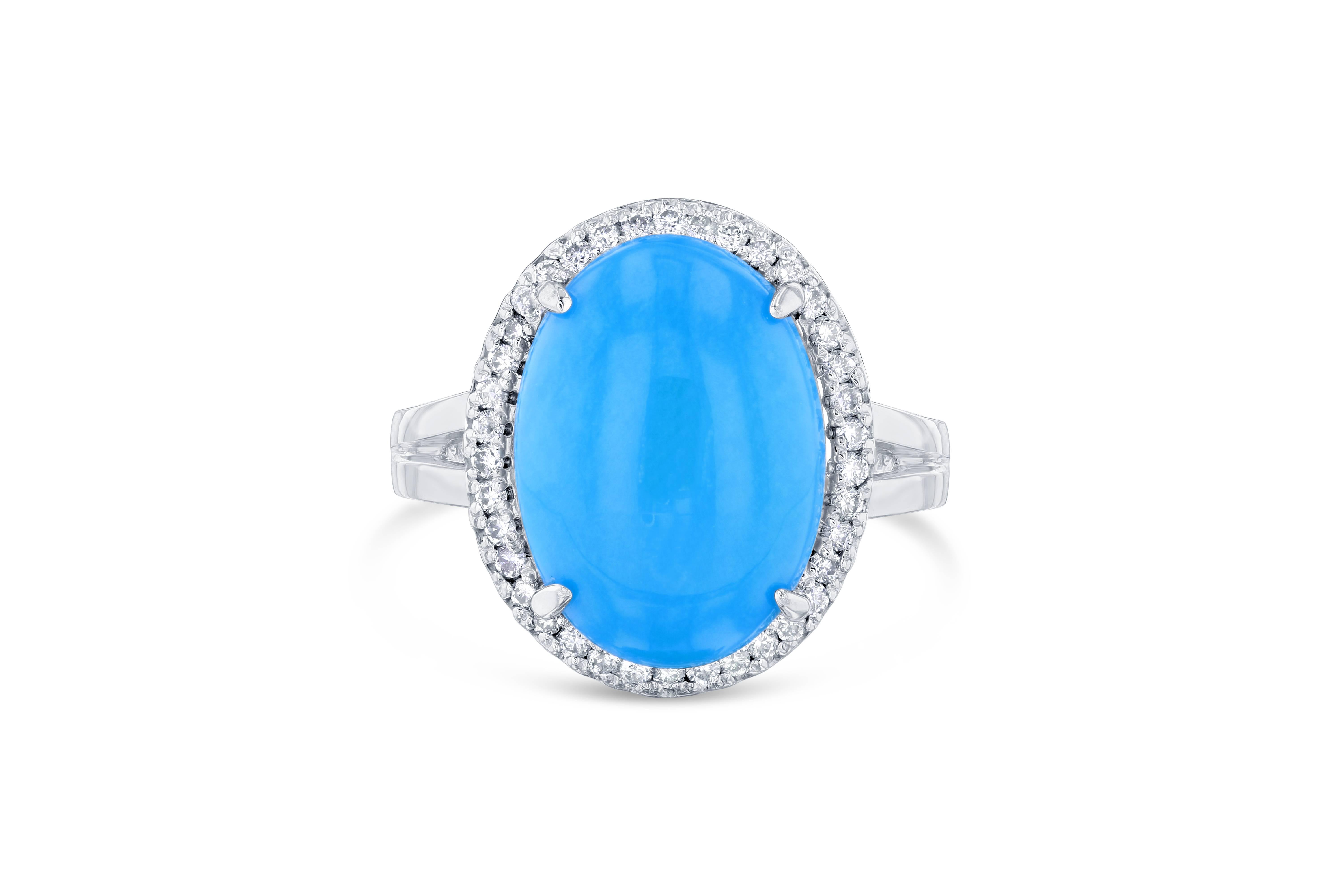 Beautiful Turquoise Diamond Cabochon Cocktail Ring!
The Oval Cut Cabochon Turquoise is 4.48 carats and has a halo of 40 Round Cut Diamonds weighing 0.24 carats.  The total carat weight of the ring is 4.72 carats.

It is crafted in 14K Yellow Gold