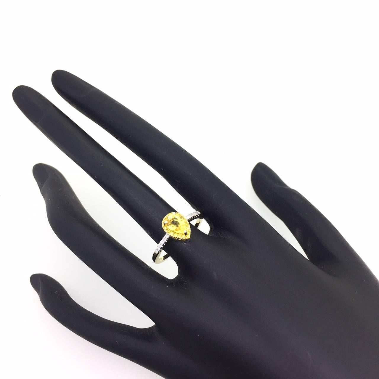 Contemporary 1.19 Carat Yellow Sapphire Yellow Diamond 14 Karat Yellow Gold Halo Diamond Ring