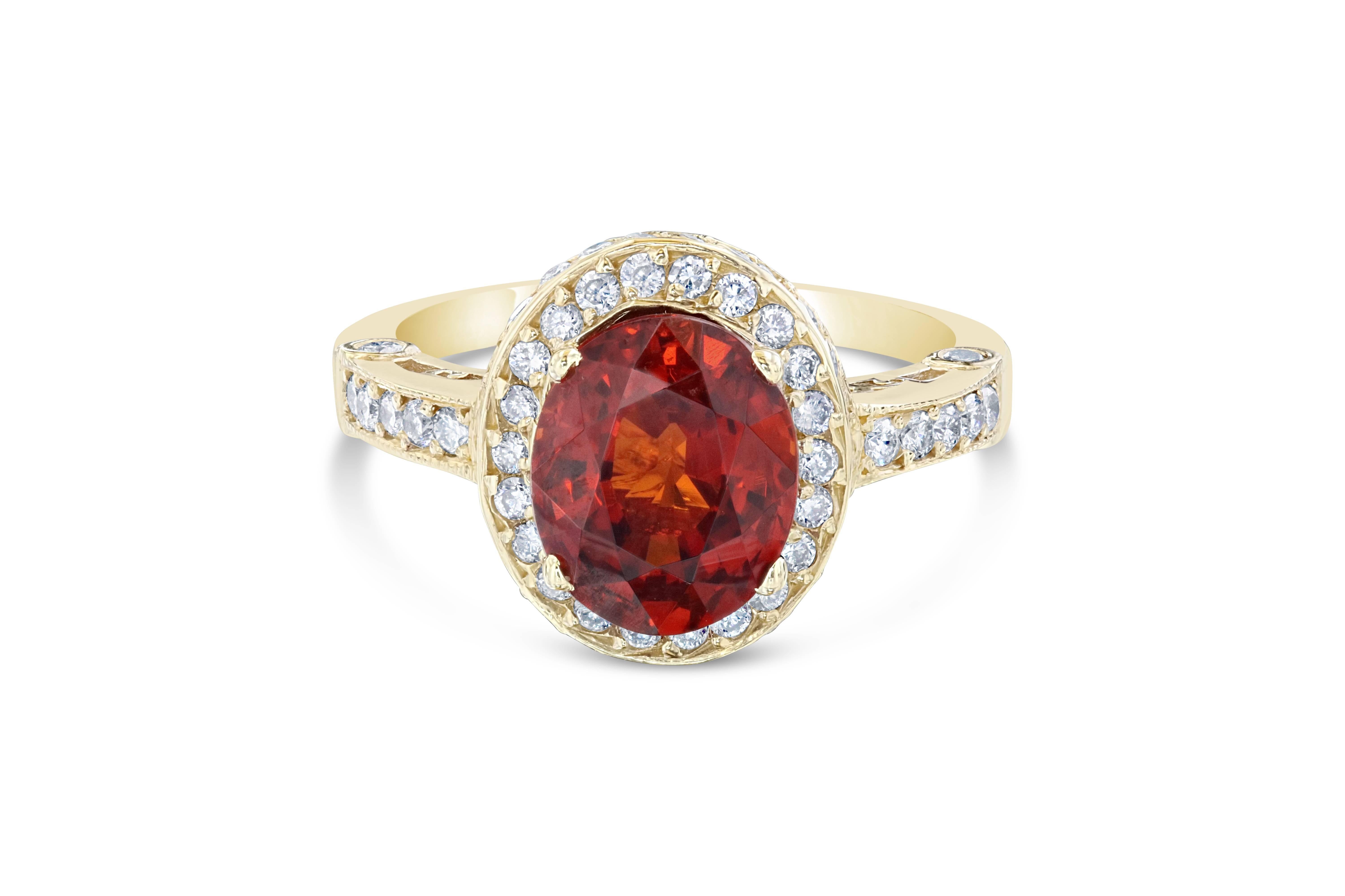 A gorgeous ring that can double as an engagement ring.  This beautiful ring has a 3.78 carat Oval Cut Spessartite set in the center of the ring. A Spessartite is a natural stone that is actually a part of the Garnet family of stones. The ring is
