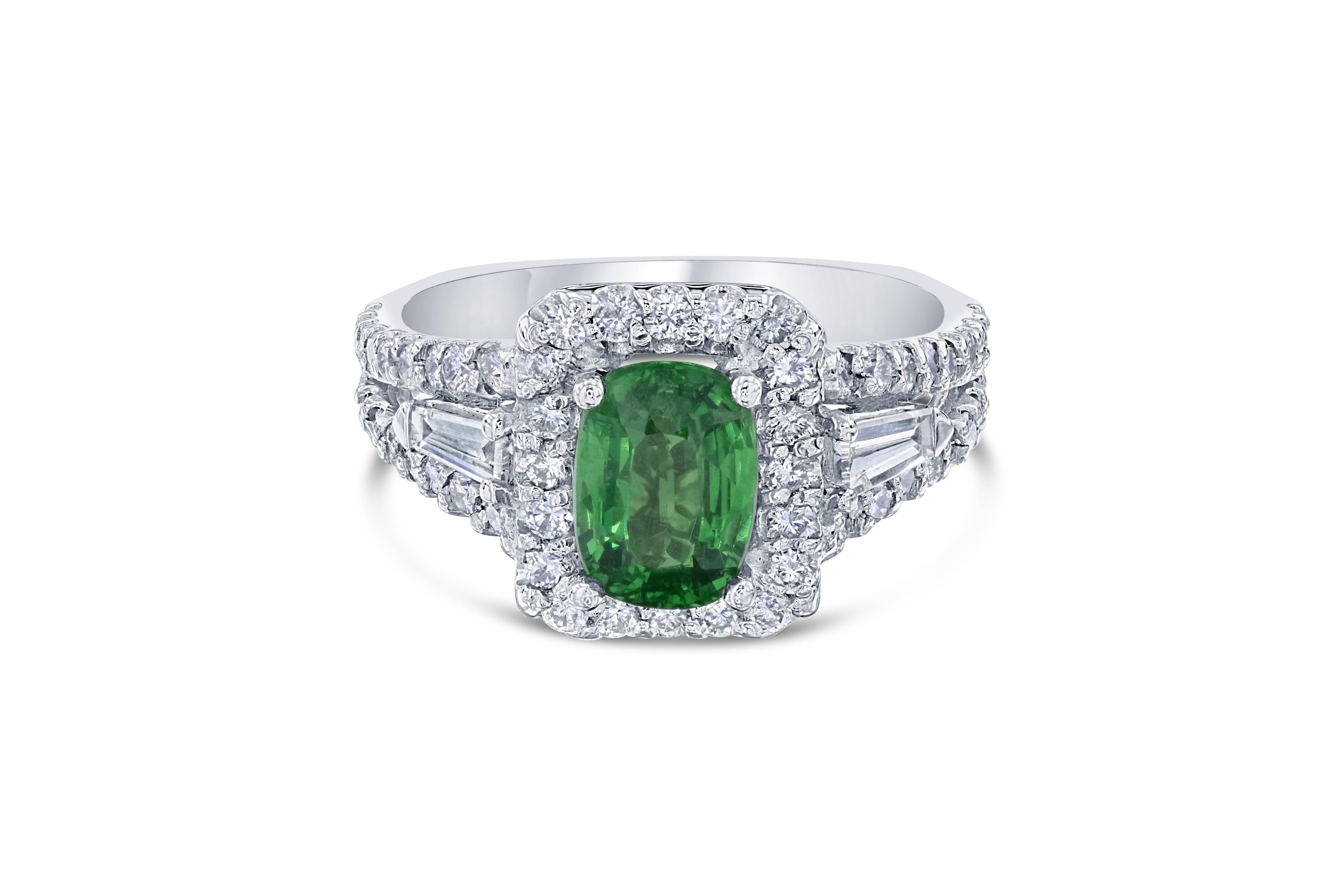 Elegant and unique setting that can compliment anyone!  This ring can easily transform into an engagement ring for the woman who wants to dip into something new and fresh.  

This ring has an Emerald cut Tsavorite which weighs 1.77 carats and is