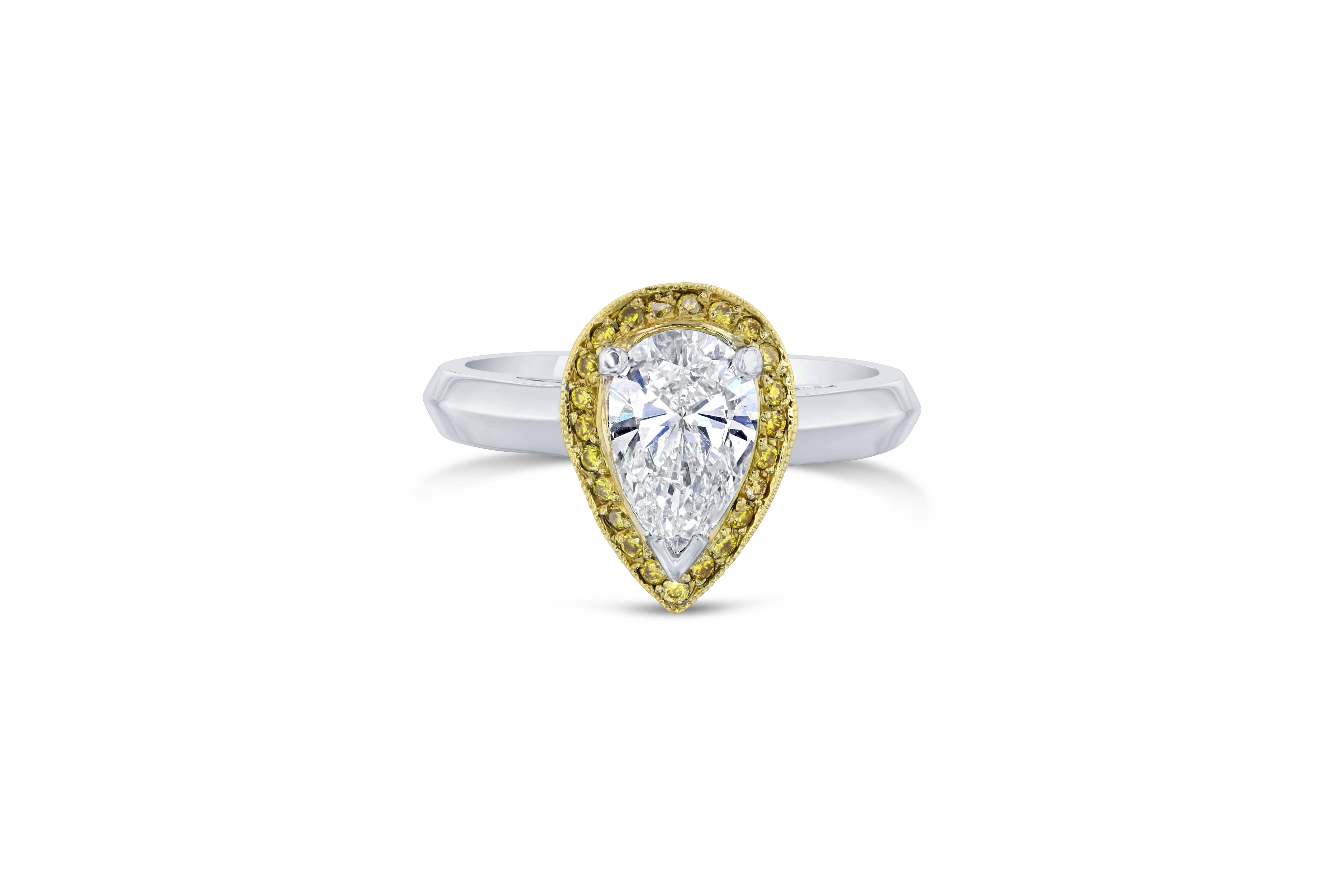 Stunning Pear Cut Diamond Ring! 

The center Pear Cut Diamond is 1.05 Carats surrounded by 23 Natural Yellow Diamonds that weigh 0.13 Carats. The total carat weight of the ring is 1.18 Carats. 

It is set in 14K White Gold and is 5.5 grams. The ring