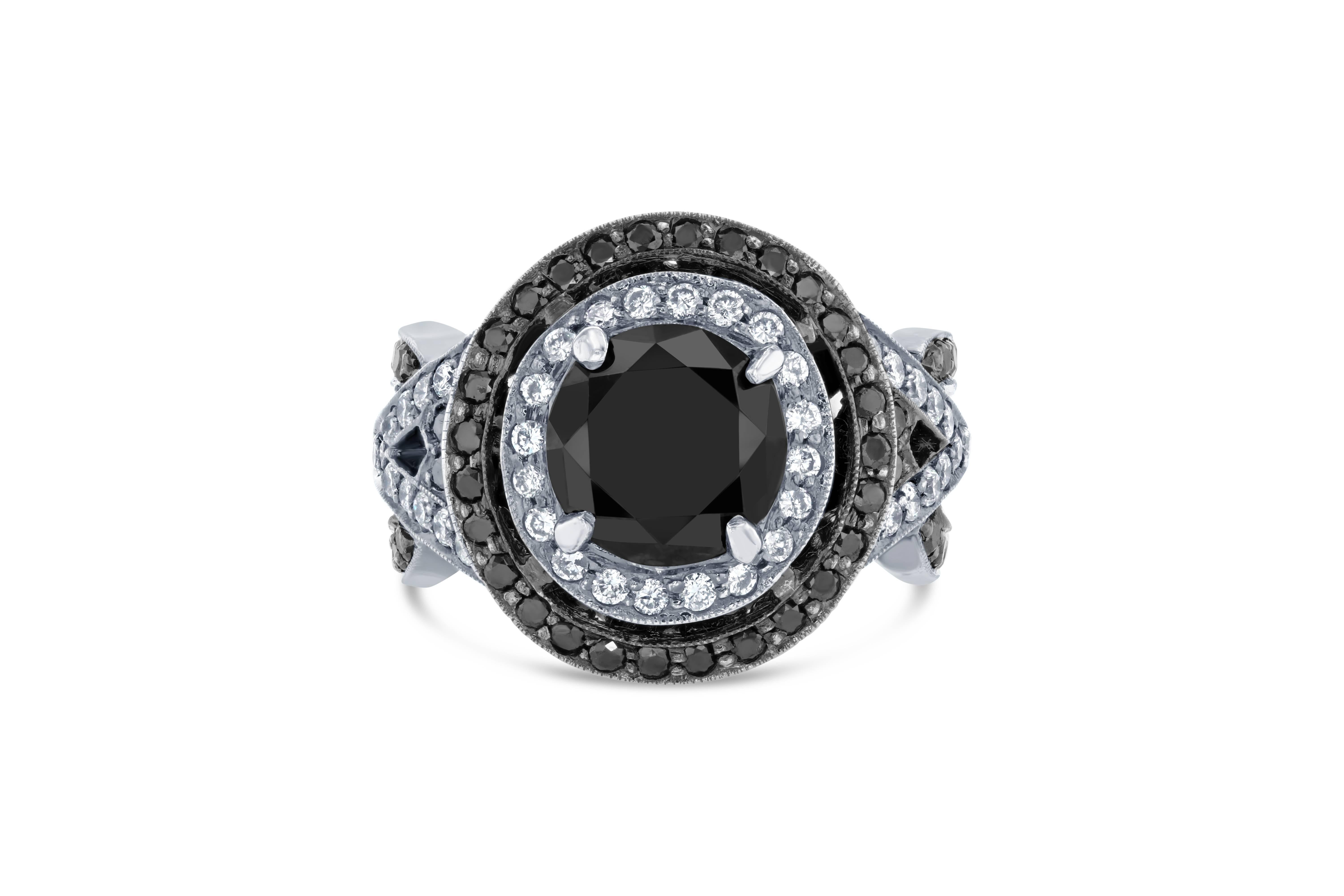 4.51 Carat Round Cut Black Diamond White Gold Bridal Ring!

Gorgeous Black Diamond ring that can transform into an Engagement ring.  There is a 3.03 carat Round Cut Black Diamond in the center on the ring which is surrounded by 44 White Round Cut