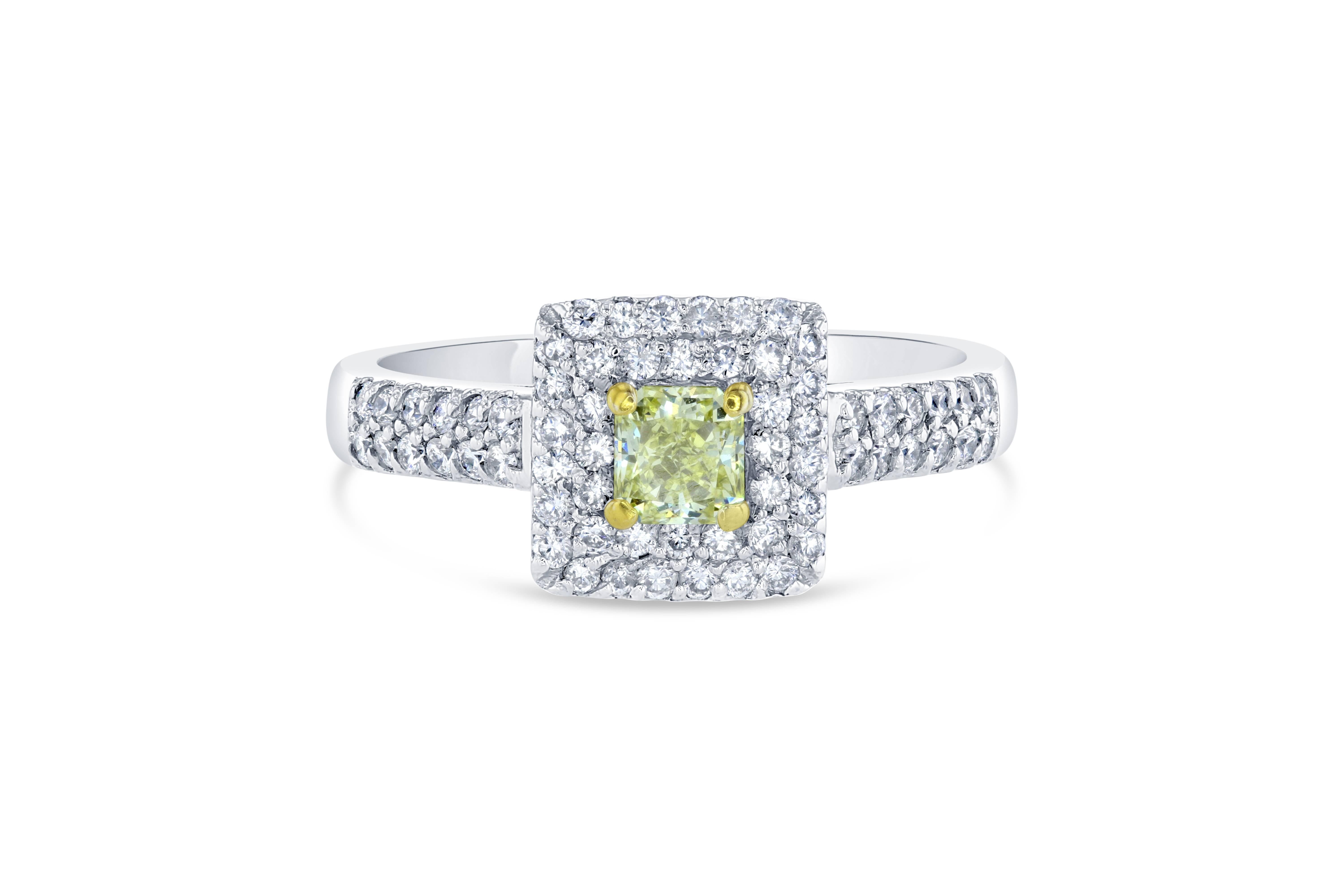 A gorgeous engagement ring that will leave her breathless! 

The center Yellow diamond is a Princess cut weighing 0.38 carat.  This is a Natural Intense Yellow Diamond with a Clarity of VS2.  It is surrounded by 64 Round cut diamonds weighing 0.50