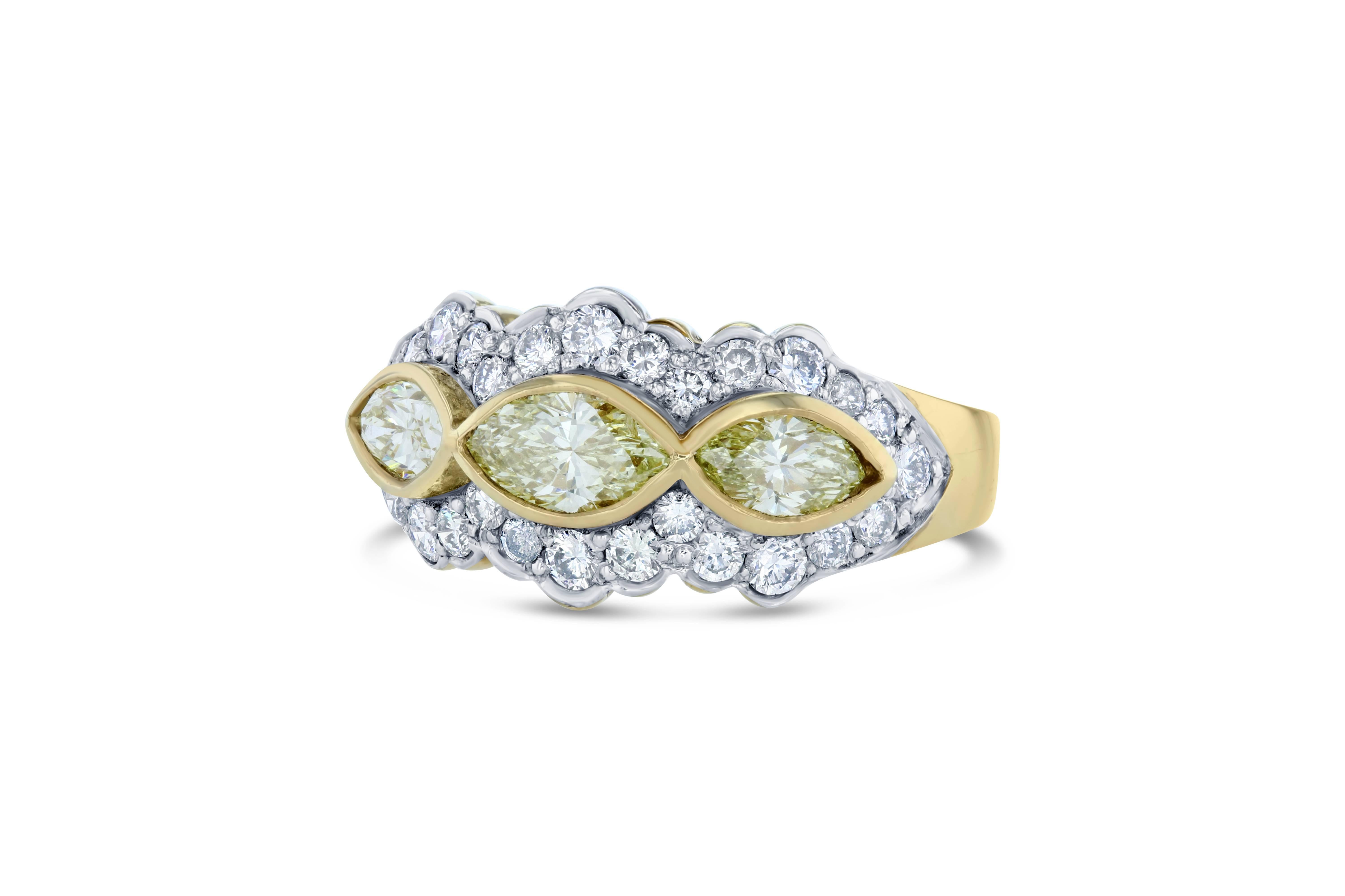 A gorgeous cocktail ring that will elevate your accessory collection ! 

There are 3 Natural Marquise cut Yellow Diamonds that weigh 0.97 carat and are surrounded by 28 Round cut diamonds that weigh 0.70 carat. The total carat weight of the ring is