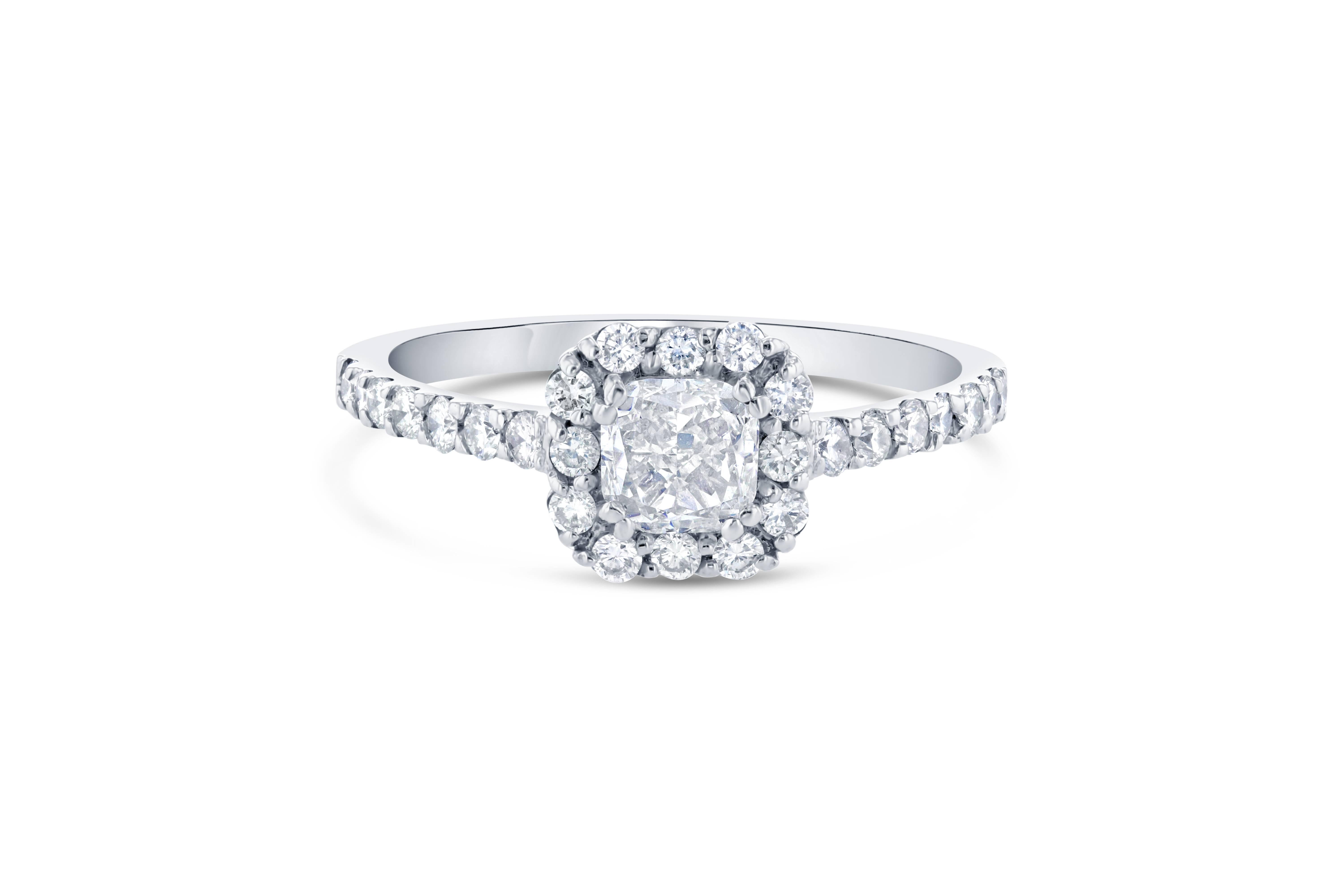 Delicate Cushion Cut Diamond Ring!

The center Cushion Cut Diamond is 0.65 Carats with a halo of 26 Round Cut Diamonds that weighs 0.36 Carats. The total carat weight of the ring is 1.01 Carats.

It is set in 14K White Gold and is 2.2 grams. The