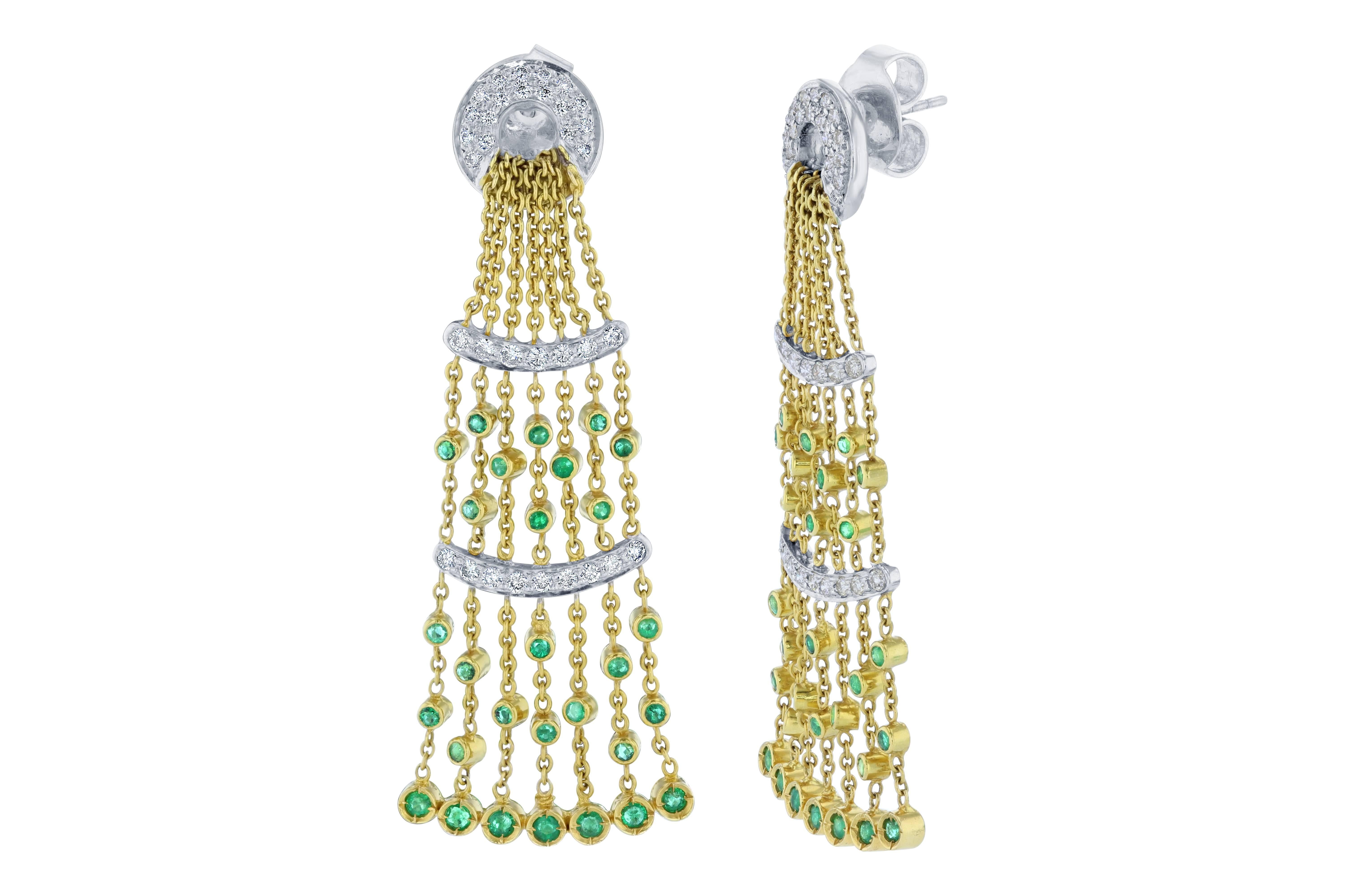 Gorgeous is simply an understatement!!! These beautiful earrings have 58 Emeralds that are falling like a delicate rain fall and weigh 1.50 carats. There are 68 Round Cut Diamonds weighing 1.26 Carats and have a clarity and color of SI1-F. 

They