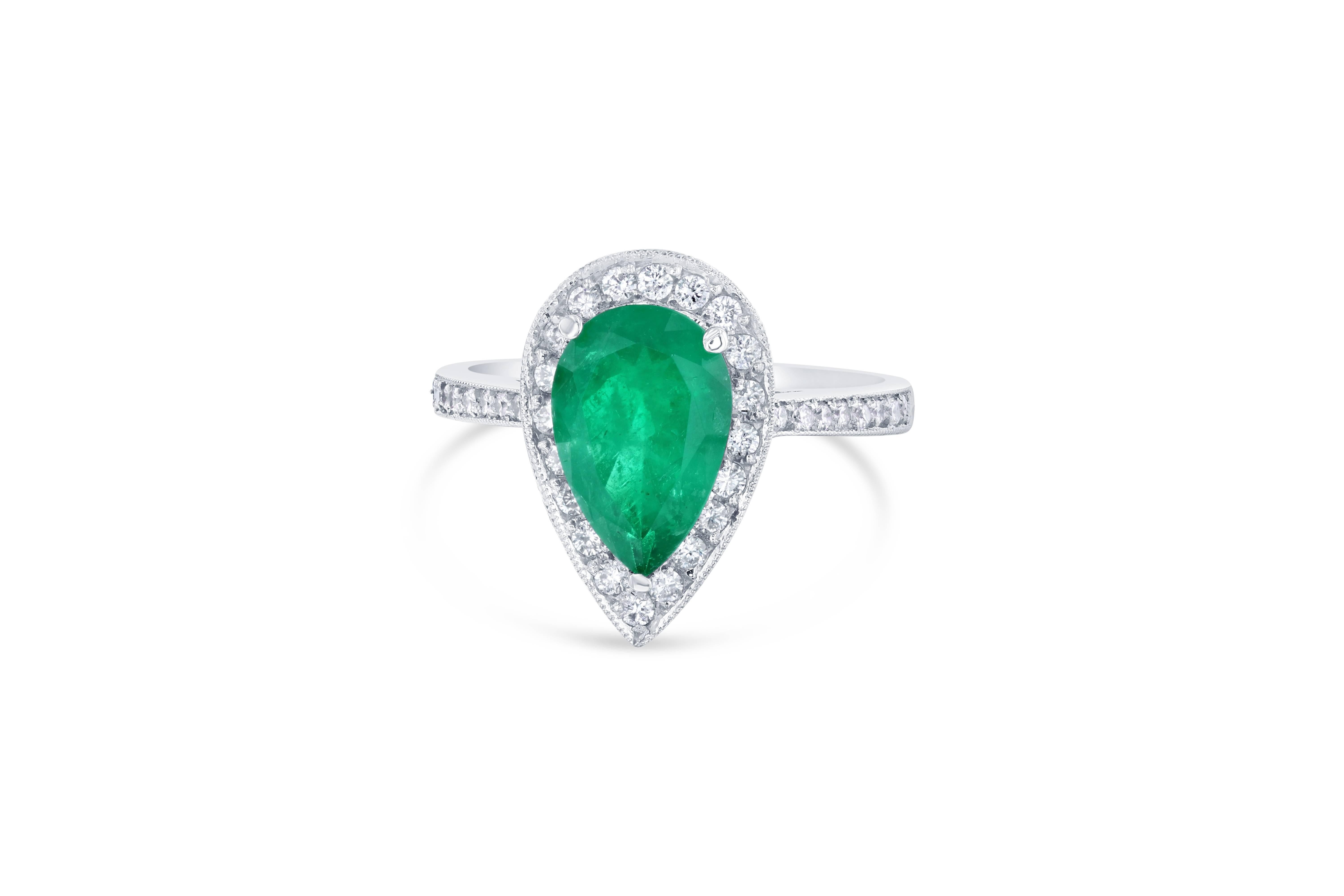 This is a gorgeous, gorgeous, gorgeous Colombian Emerald and Diamond Ring!  This 18K White Gold Ring has a stunning GIA certified Pear Cut Emerald that weighs 1.87 carats. It has 75 Round Cut Diamonds that weigh 0.69 carat (Clarity: VS2, Color: F). 