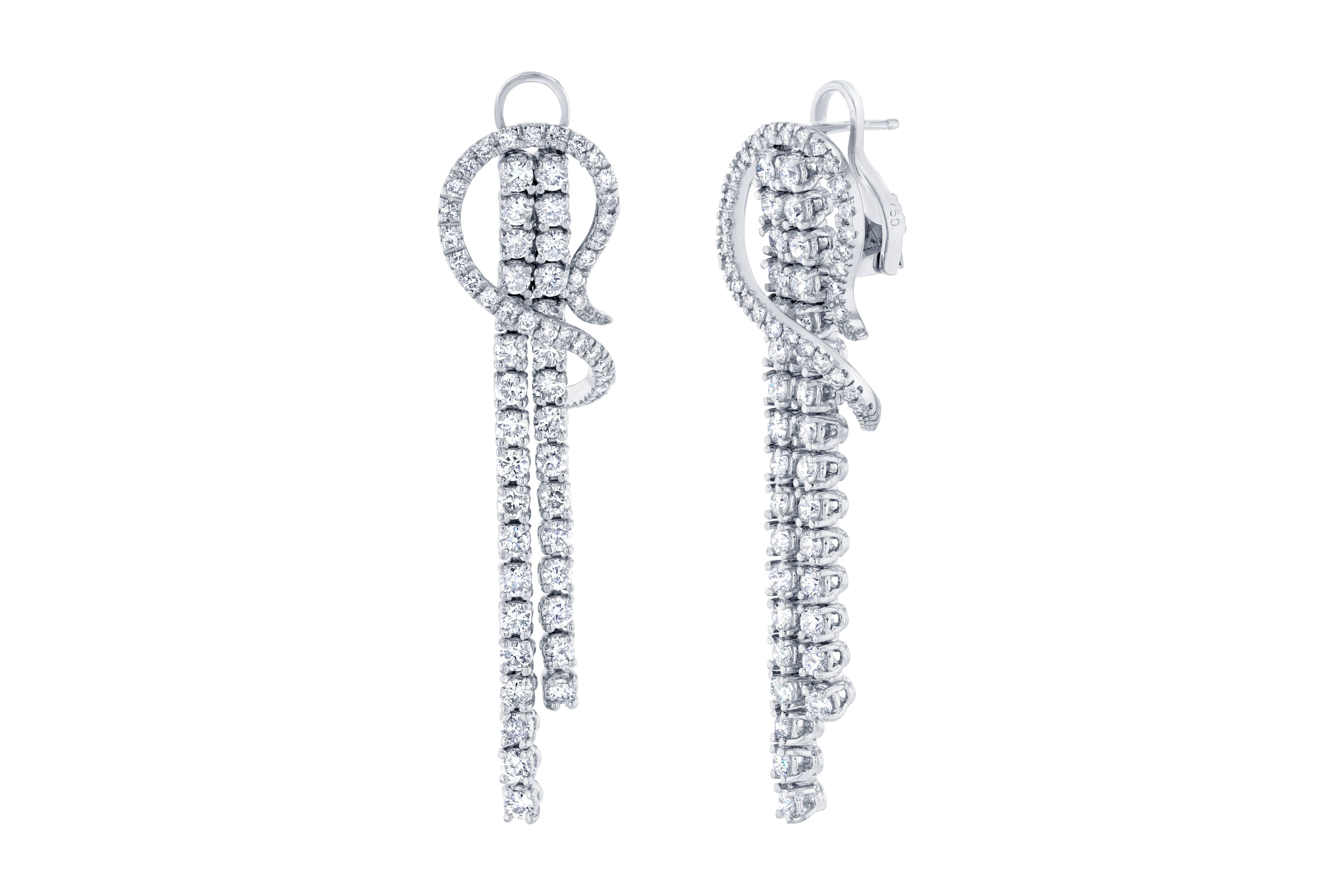 These are some gorgeous earrings that are sure to compliment everyone's wardrobe!  The earrings are designed to elevate your look and are sure to stir up lots of conversation.     There are 124 Round Cut Diamonds that weigh 4.75 carats.  Made in 14K