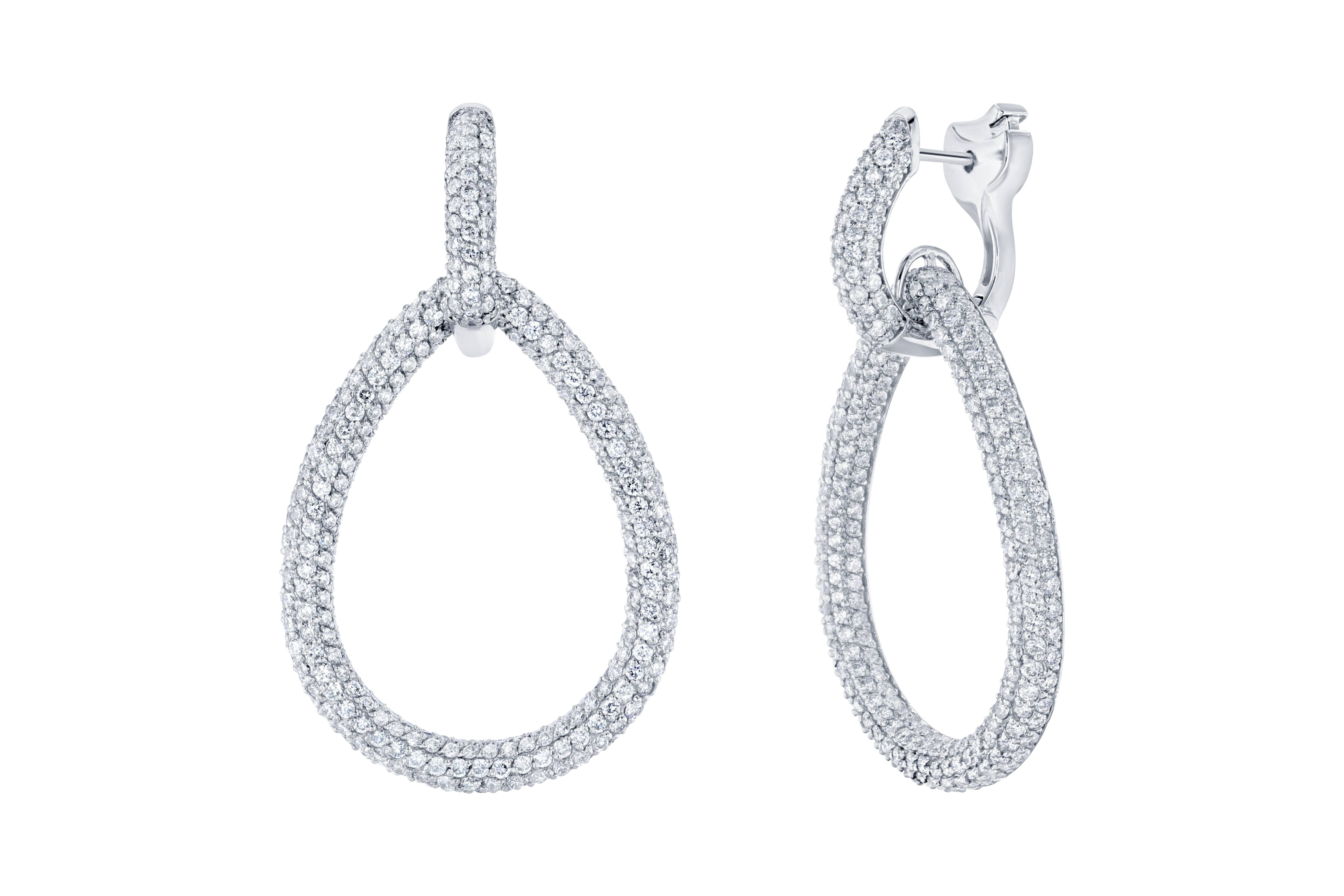 These are some real stunners!  These earrings have 712 Round Cut Diamonds that weigh 7.30 carats (Clarity: VS2, Color: F) and are pave set in a 18K White gold mounting that weighs 18.0 grams.  The earrings are approximately 1.80 inches long.   The