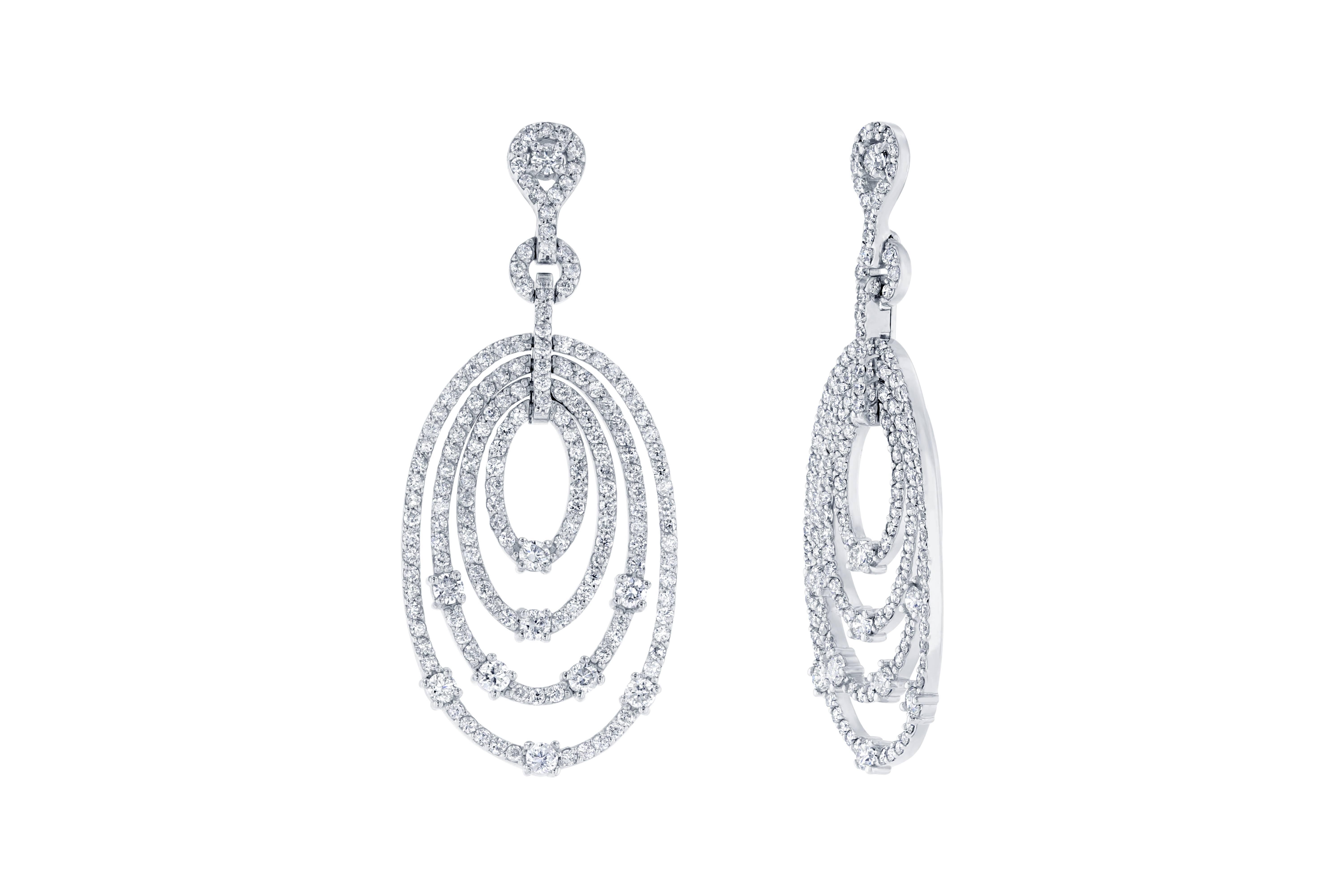 These beautiful drop earrings have 340 Round Cut Diamonds that weigh 4.27 carats (Clarity: SI1, Color: F).  The earrings are made in 14K White Gold and weigh approximately 11.6 grams.  The length is approximately 1.9 inches and the backing is a