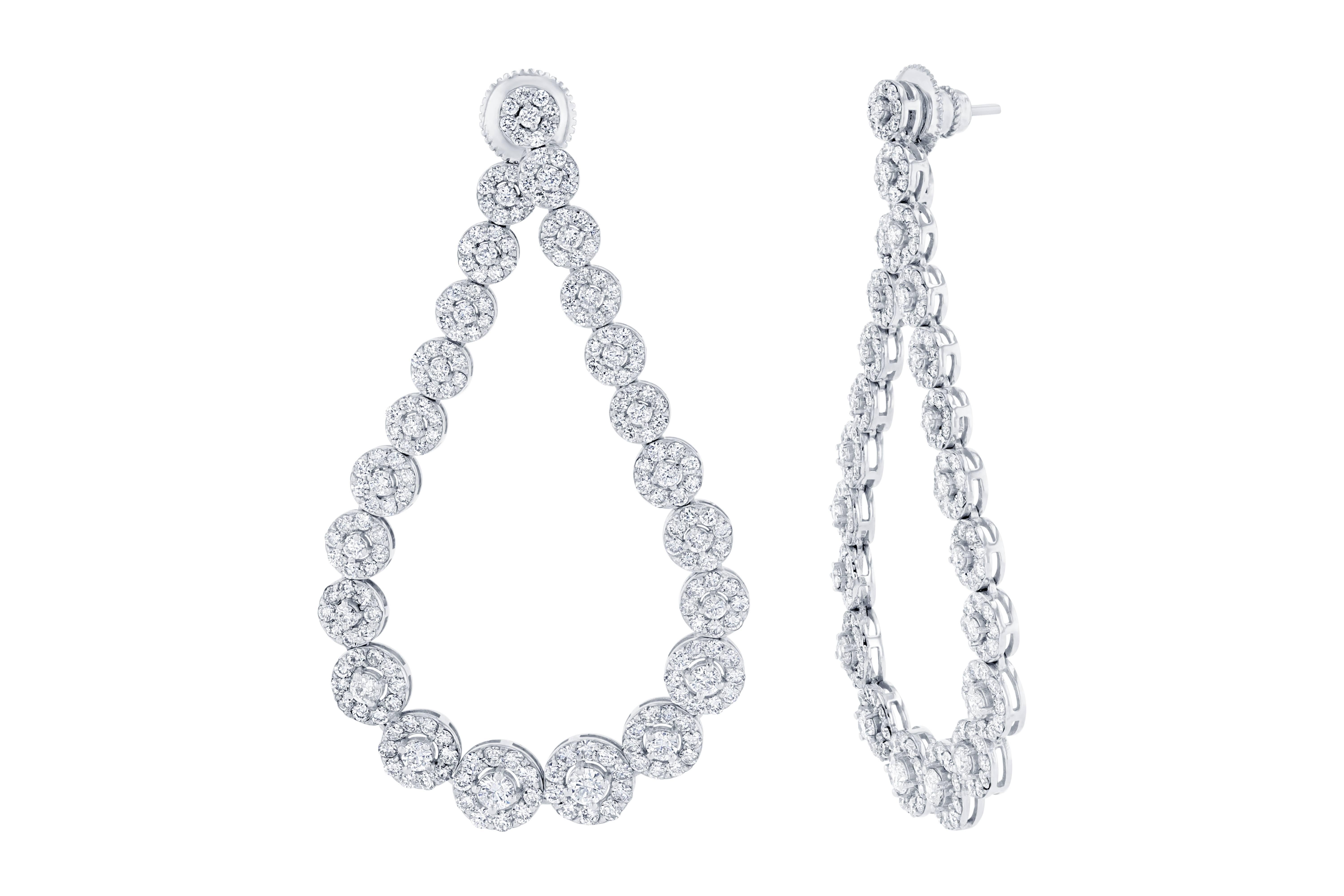 These stunners are made to elevate your wardrobe and make you look fabulous!!  The setting is very unique and flattering.  There are 438 Round Cut Diamonds that weigh 7.66 carats (Clarity: SI2, Color: F).  The design of the earrings is a graduating
