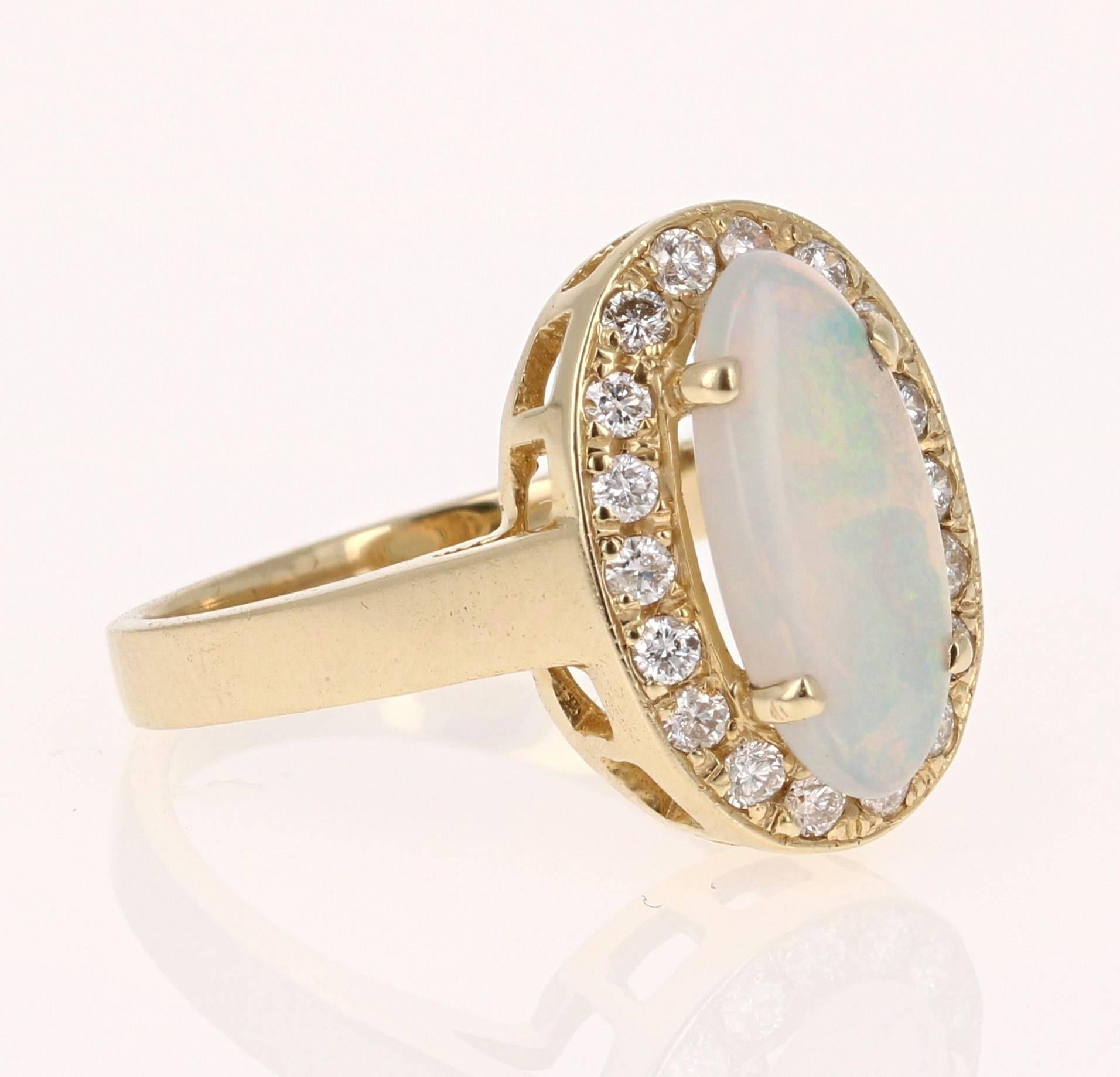 Cute and dainty ring that can be a great addition to anyone's accessory collection!   This ring has a 1.10 carat Oval Cut Opal that is set in the center of the ring and is surrounded by 18 Round Cut Diamonds that weigh 0.39 carats.  The total weight
