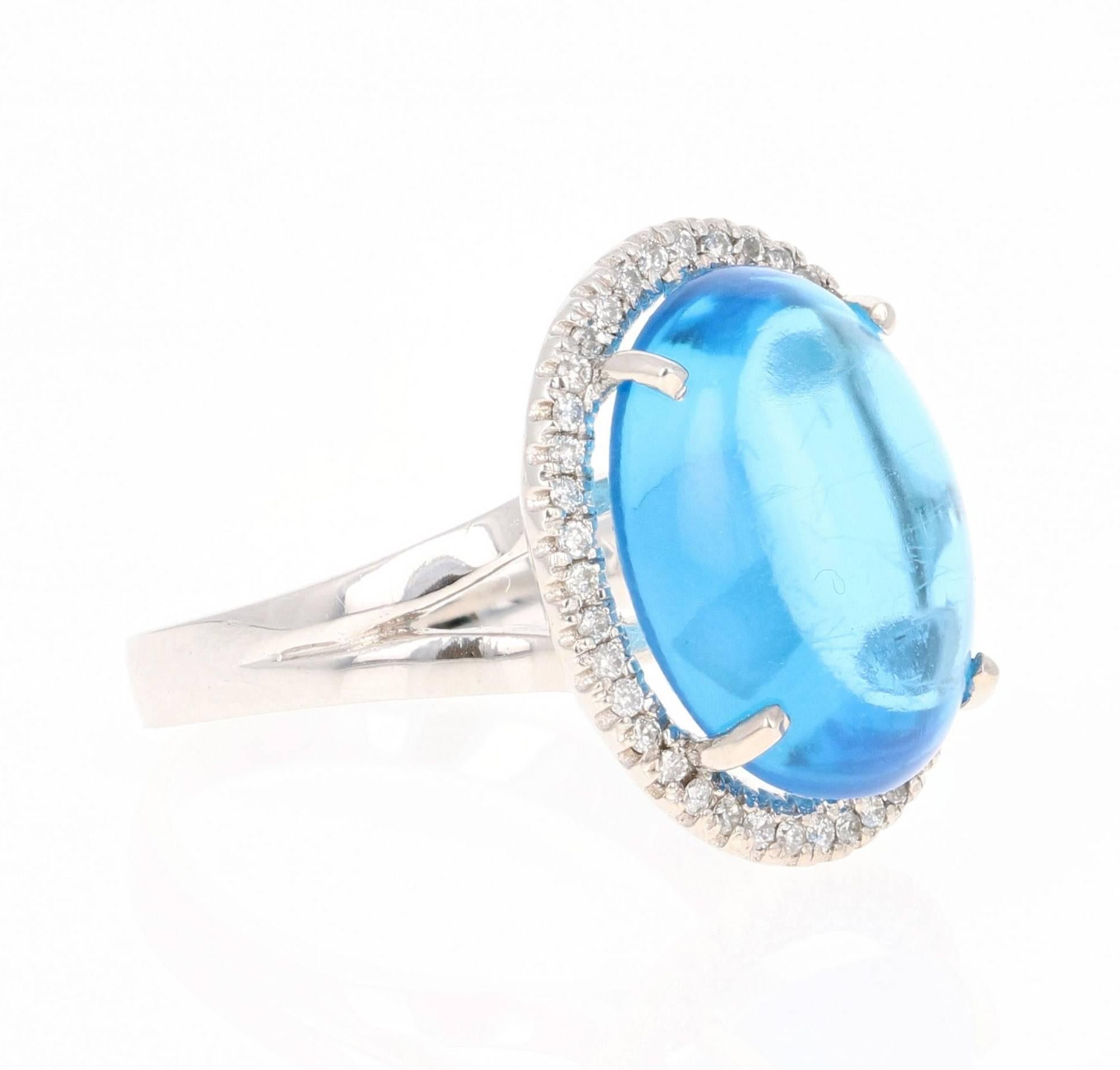This beautiful cabochon cut Blue Topaz and Diamond ring has a gorgeous 12.73 Carat Blue Topaz and its surrounded by 42 Round Cut Diamonds that weigh 0.29 Carats. The total carat weight of the ring is 13.02 Carats. 

The Oval Cut Cabochons