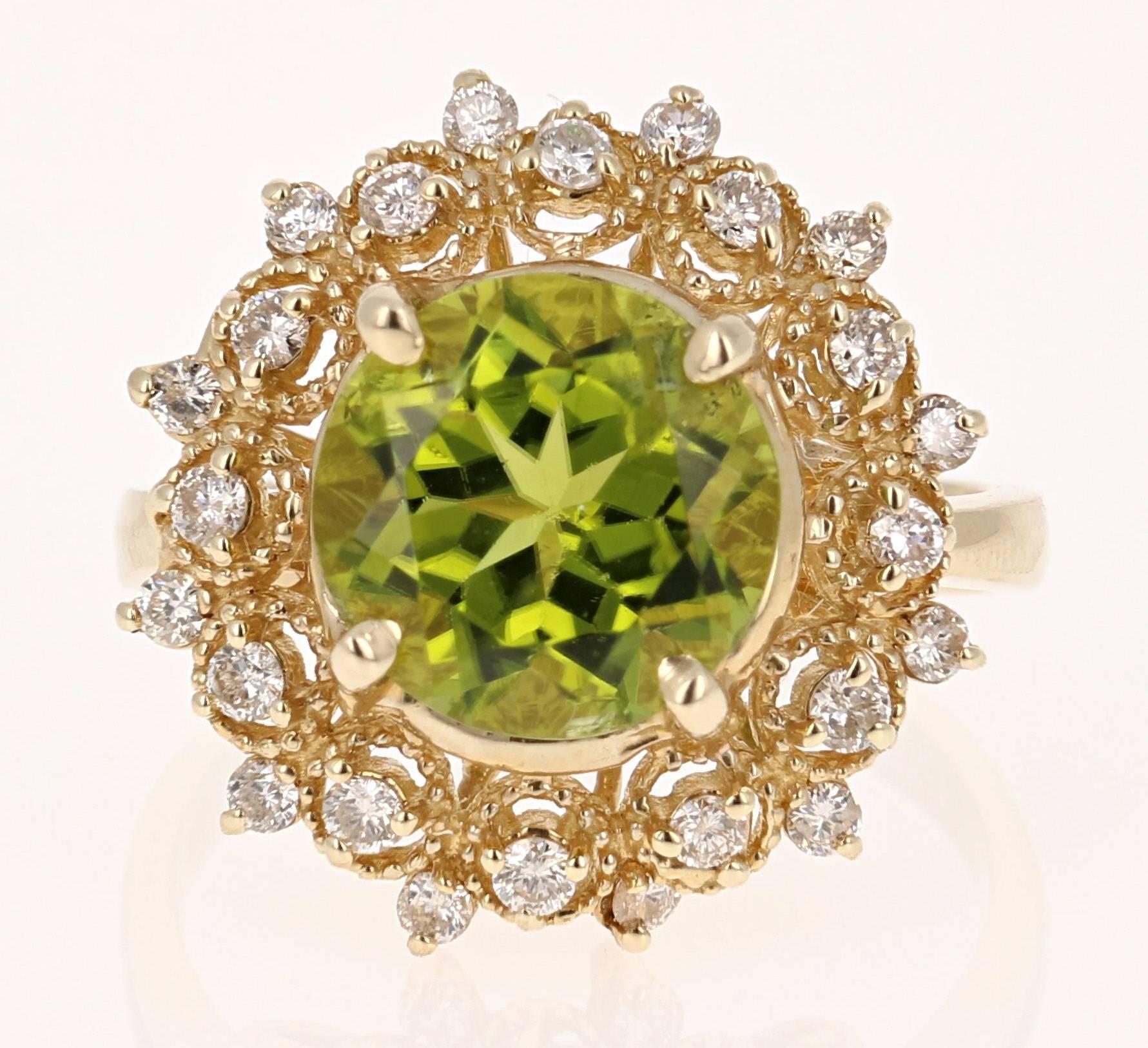 This beautiful ring has a large Round Cut Peridot in the center that weighs 4.07 carats. The ring is surrounded by 24 Round Cut Diamonds that weigh 0.67 carat.  The total carat weight of this ring is 4.74 carats. The antique and vintage style