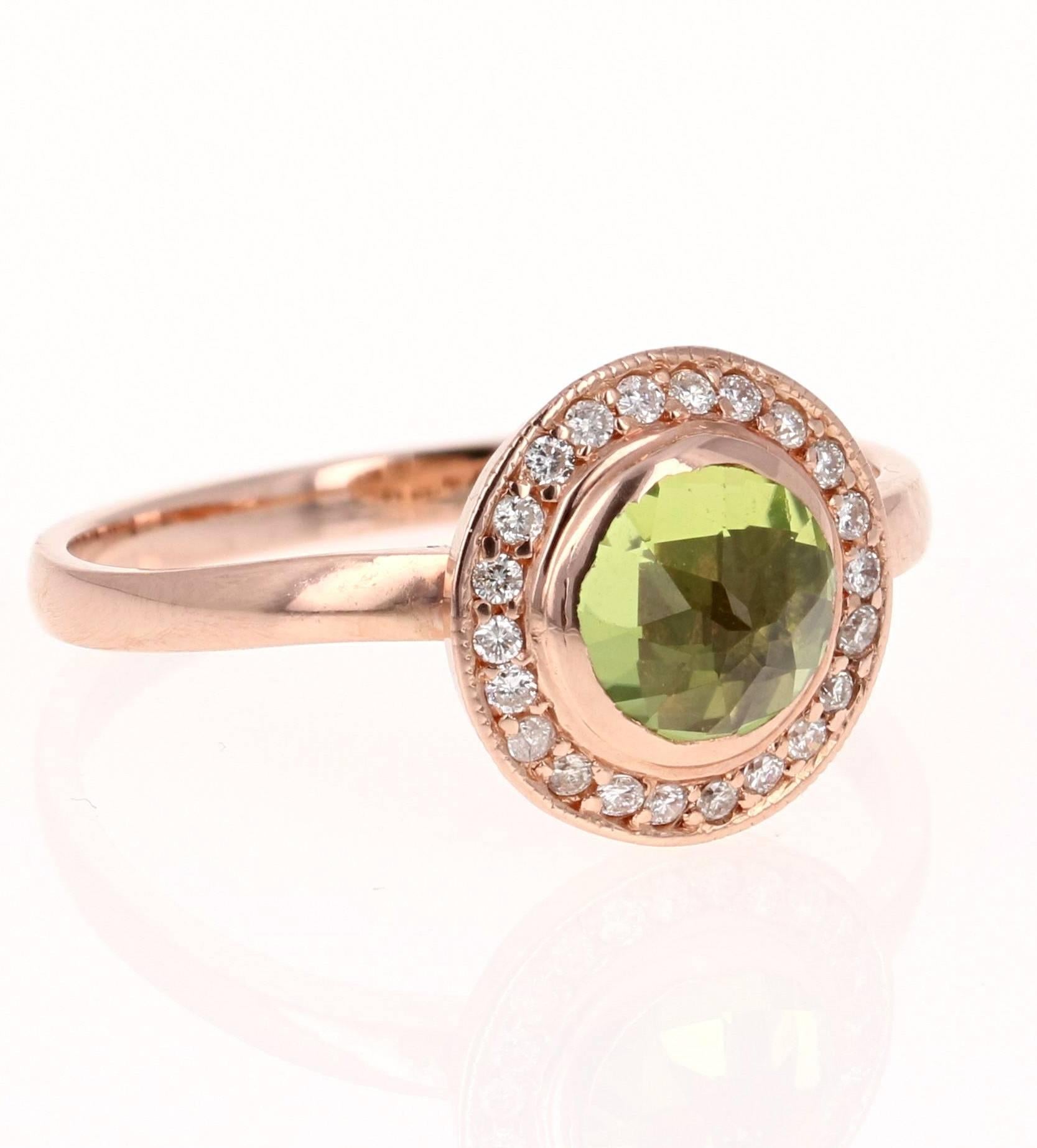 This beautiful ring has a Round Cut Peridot in the center that weighs 0.84 carats. The ring is surrounded by a cute halo of 22 Round Cut Diamonds that weigh 0.15 carats. The total carat weight of the ring is 0.99 carats. The setting is crafted in
